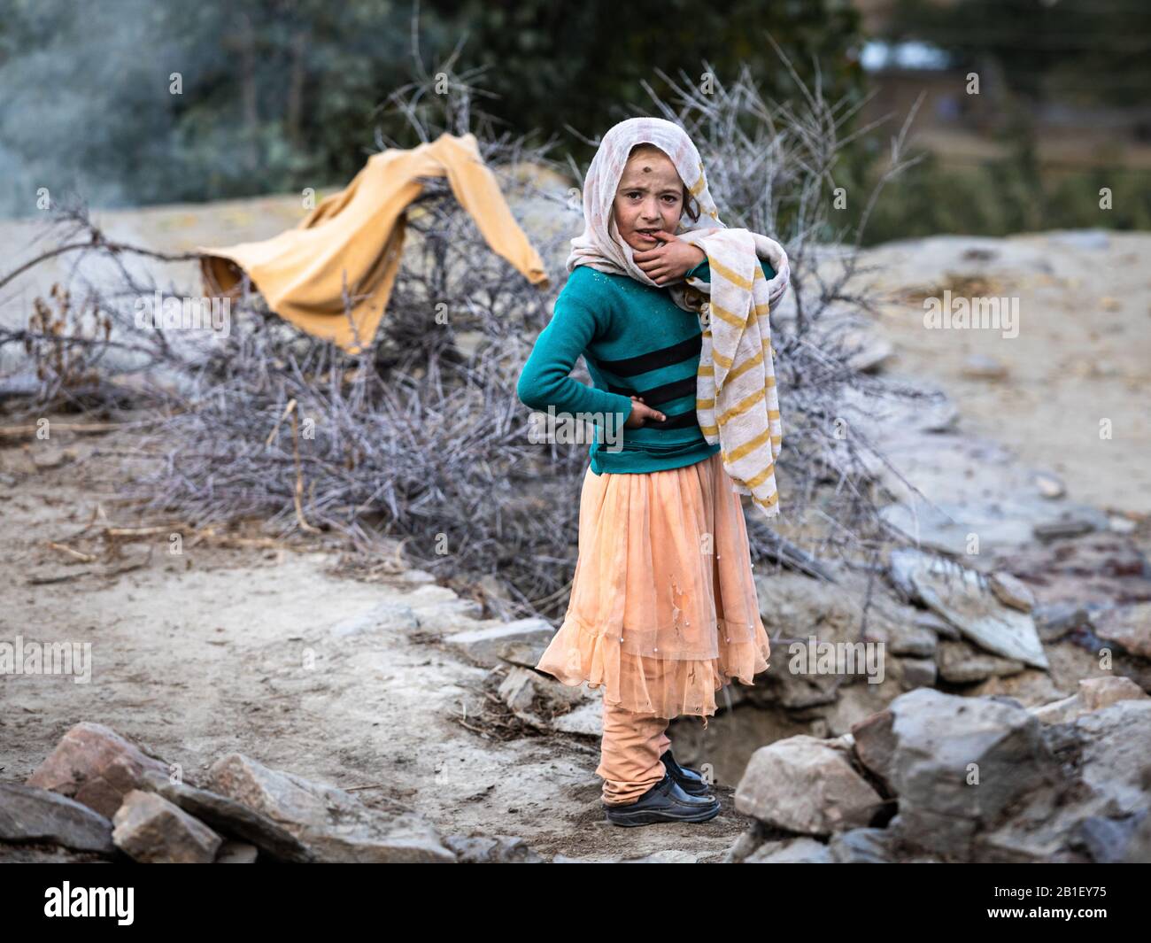 Hunza valley, Gilgit baltistan, Pakistan Muslim girl in colorful clothes from mountain village Stock Photo