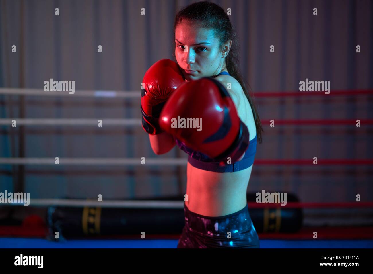 Kickboxer girl training in the ring Stock Photo - Alamy