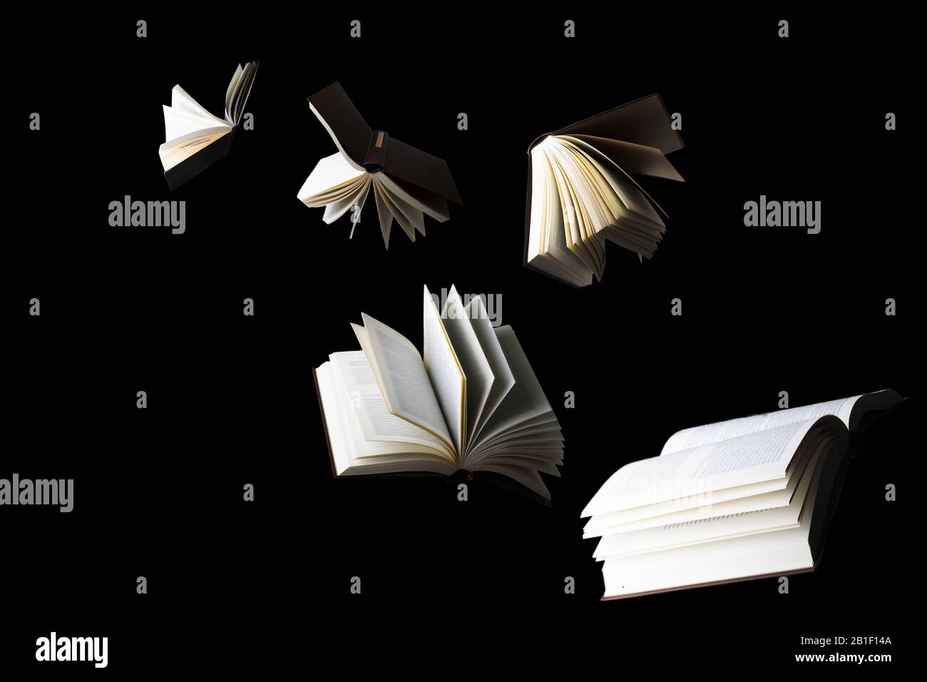 Flying books isolated on black Stock Photo