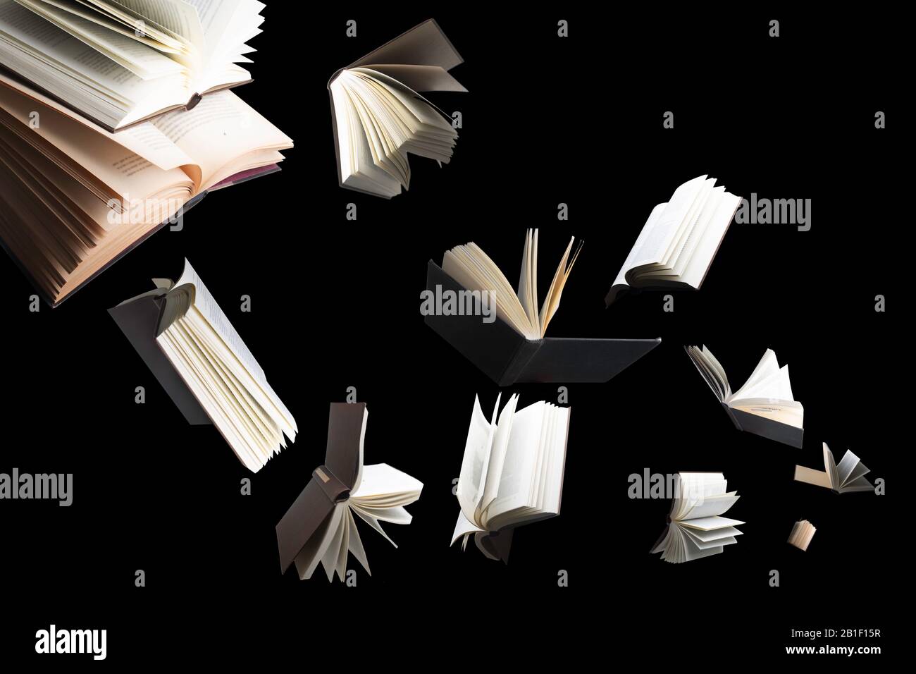 Flying several books isolated on black background. Stock Photo