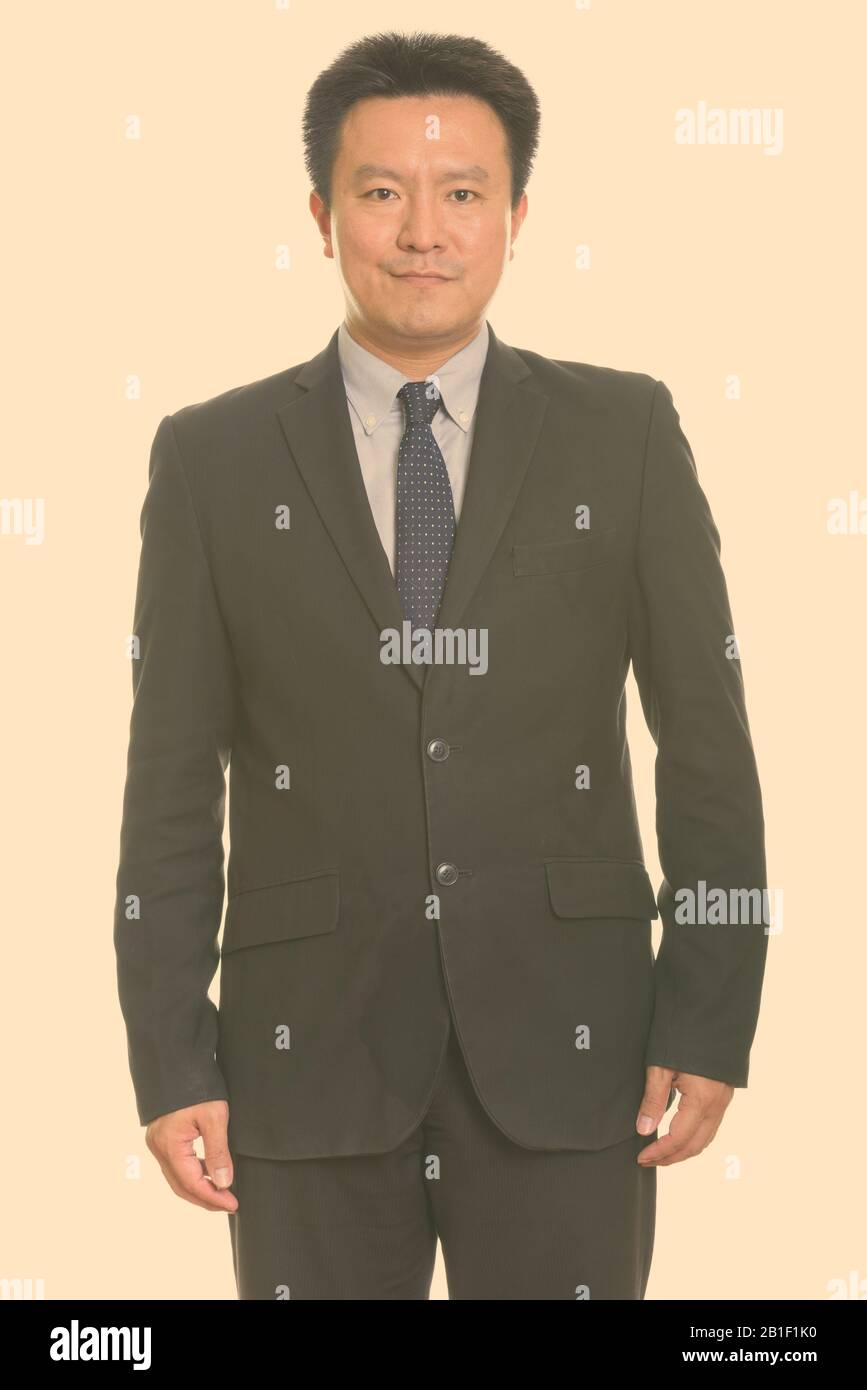 Portrait of mature handsome Japanese businessman in suit Stock Photo