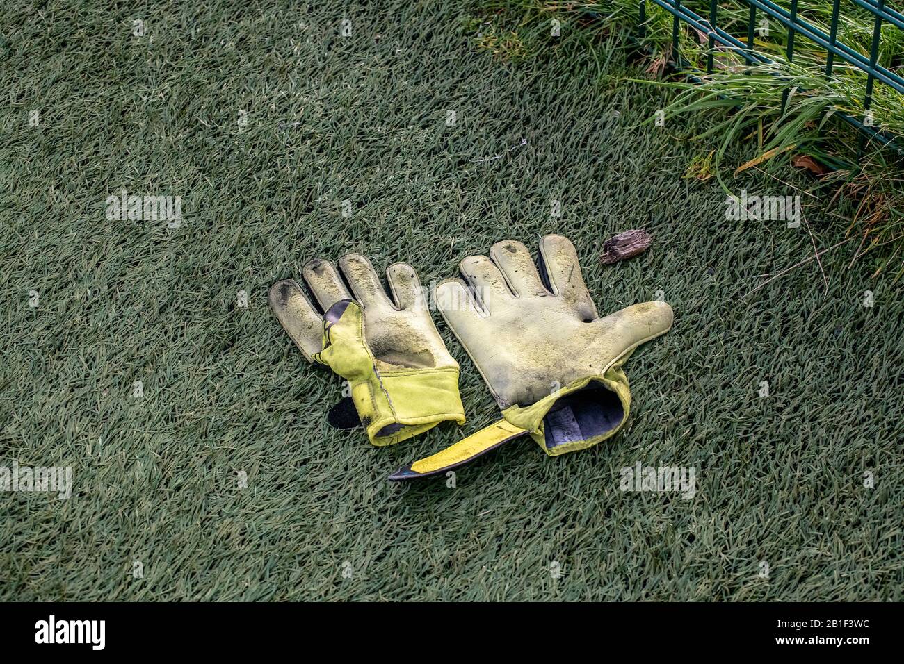 Glasgow, Scotland, UK. 16th February 2020:  Old goalkeepers gloves on the ground Stock Photo