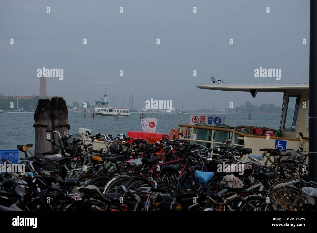 Bicycles packed tight in bike racks at the Lido Ferry Boat terminal, water and vaporetto. No bicycles are allowed on  the main island of Venice Italy Stock Photo