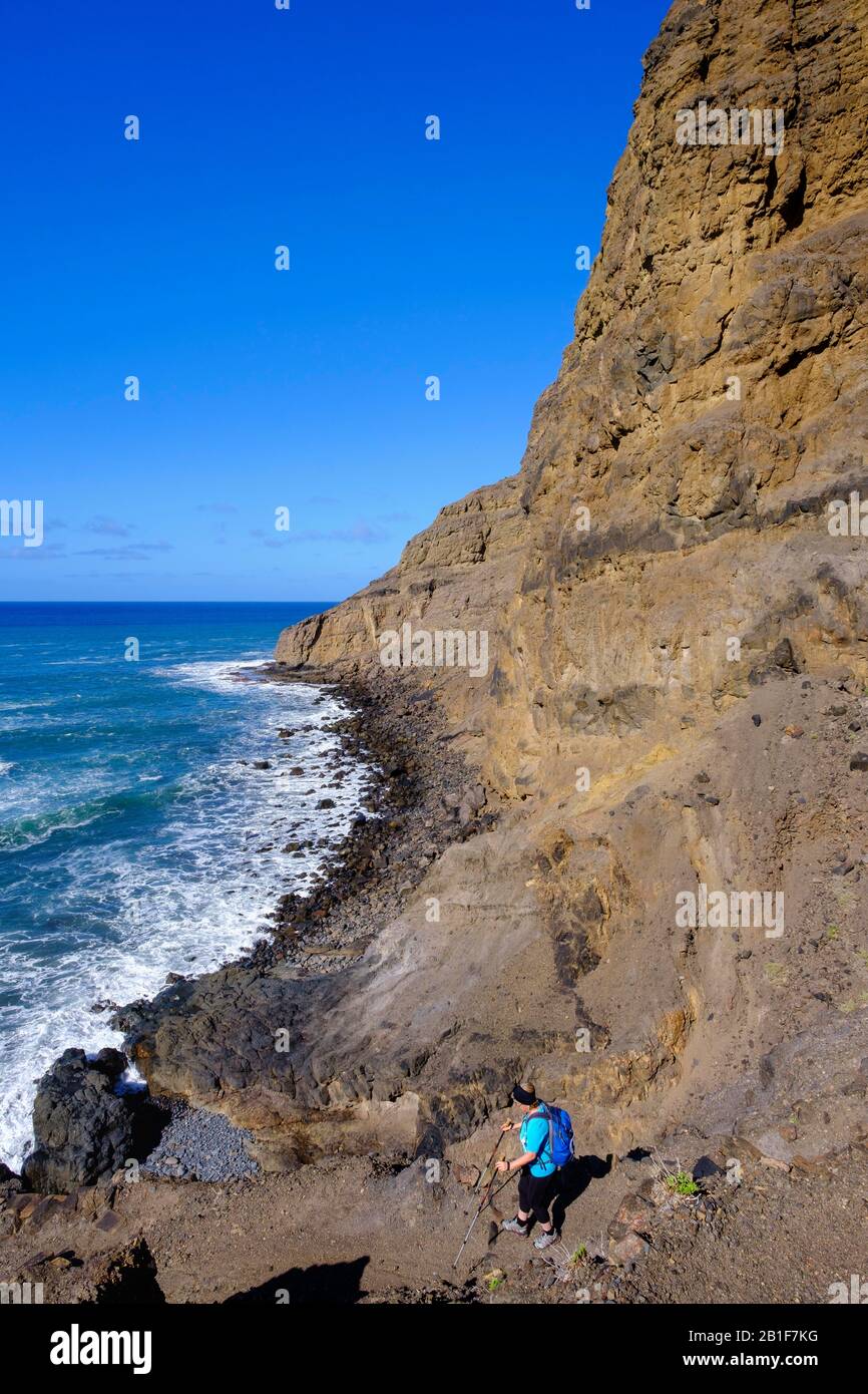 Woman hiking at the Playa de Guarinen, near Taguluche, La Gomera, Canary Islands, Spain Stock Photo