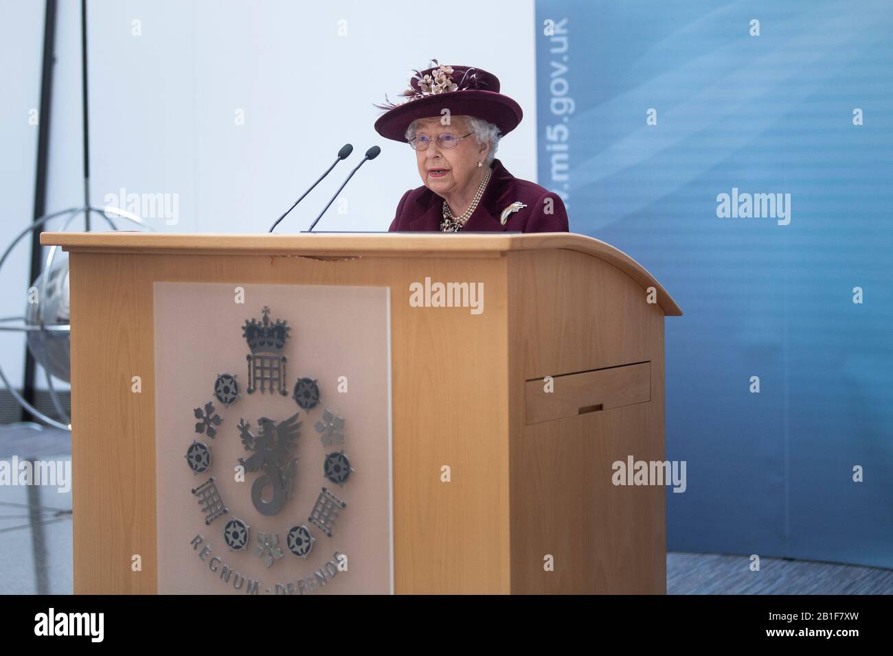 Queen Elizabeth II speaks during a visit to the headquarters of MI5 at Thames House in London. Stock Photo