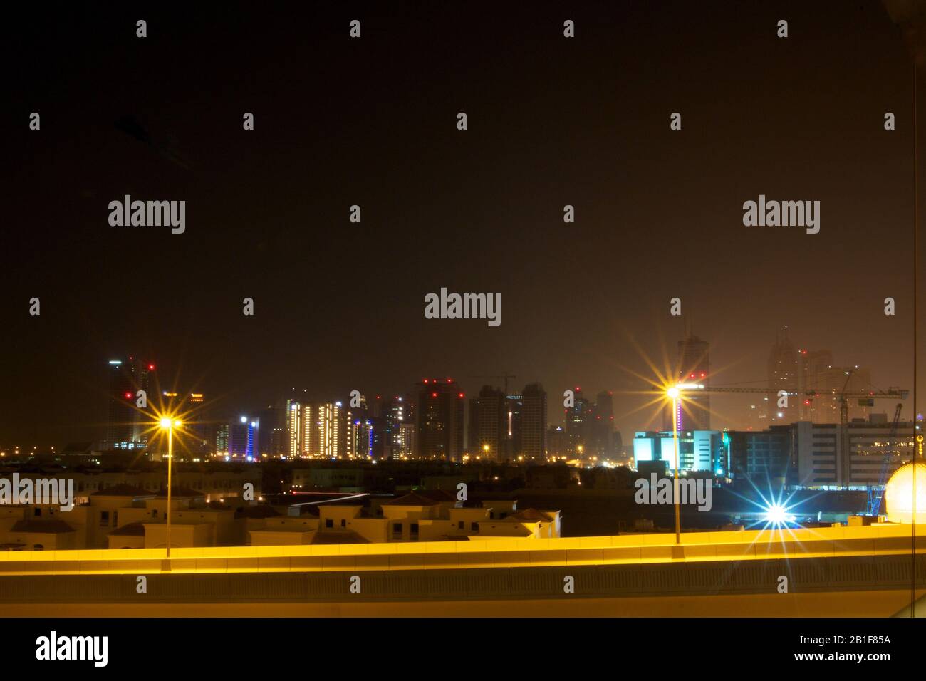 Dubai-Tecom by night seen from Al Barsha Stock Photo