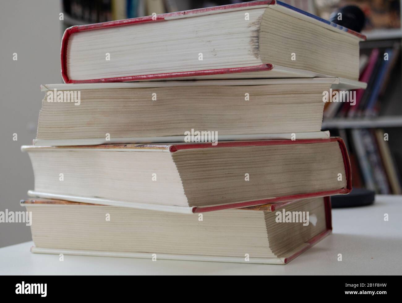 Old dirty books on the table. Books blurred background. Stock Photo