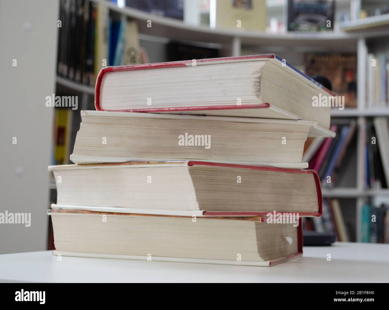 Old dirty books on the table. Books blurred background. Stock Photo