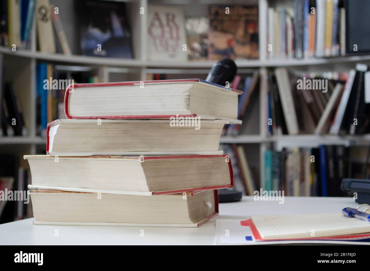 Old dirty books on the table. Books blurred background. Stock Photo