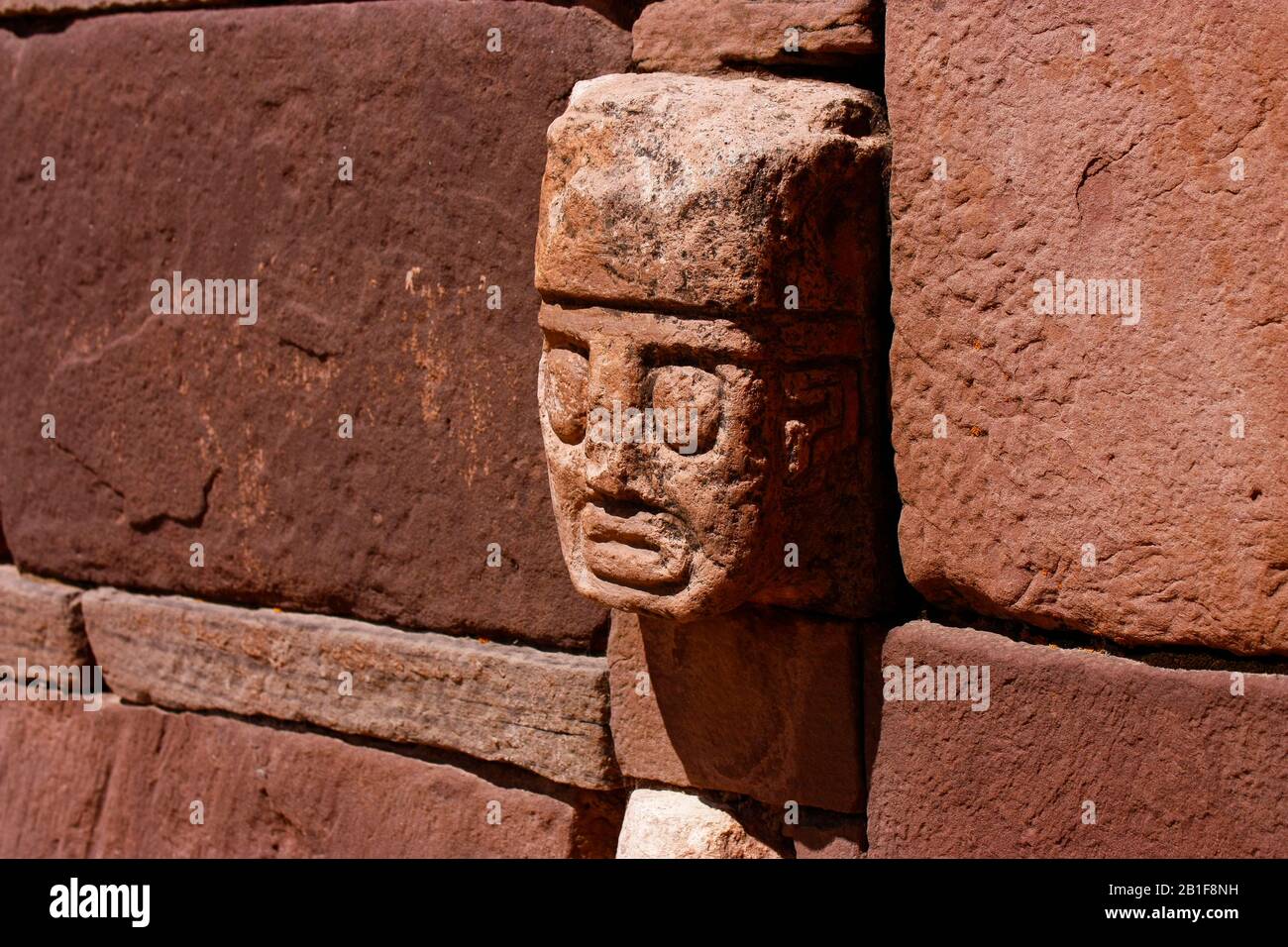 The interior of the walls surrounding Kalasasaya has severed stone heads protruding from it as a reminder of the religious ceremonies that were held t Stock Photo