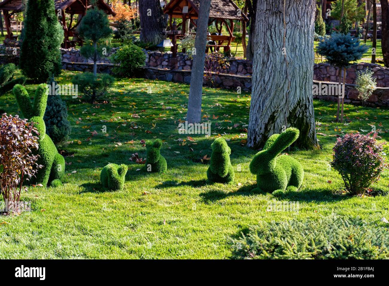 Close up green figures of different forest animals in the park Stock Photo