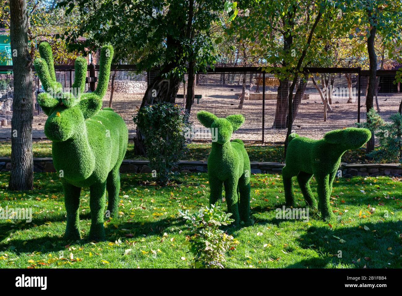 Close up green figures of different forest animals in the park Stock Photo