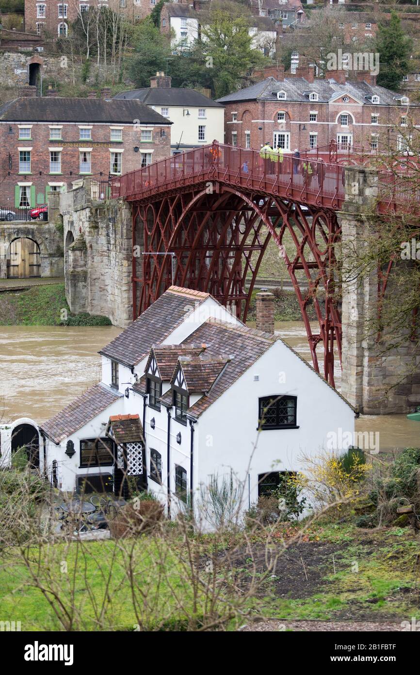 Ironbridge, Shropshire, UK. 25th Feb, 2020. Severe flood warning in place on the River Severn at Ironbridge, Shropshire. A house on the riverside is in danger of flooding as river levels continue to rise. Credit: Peter Lopeman/Alamy Live News Stock Photo