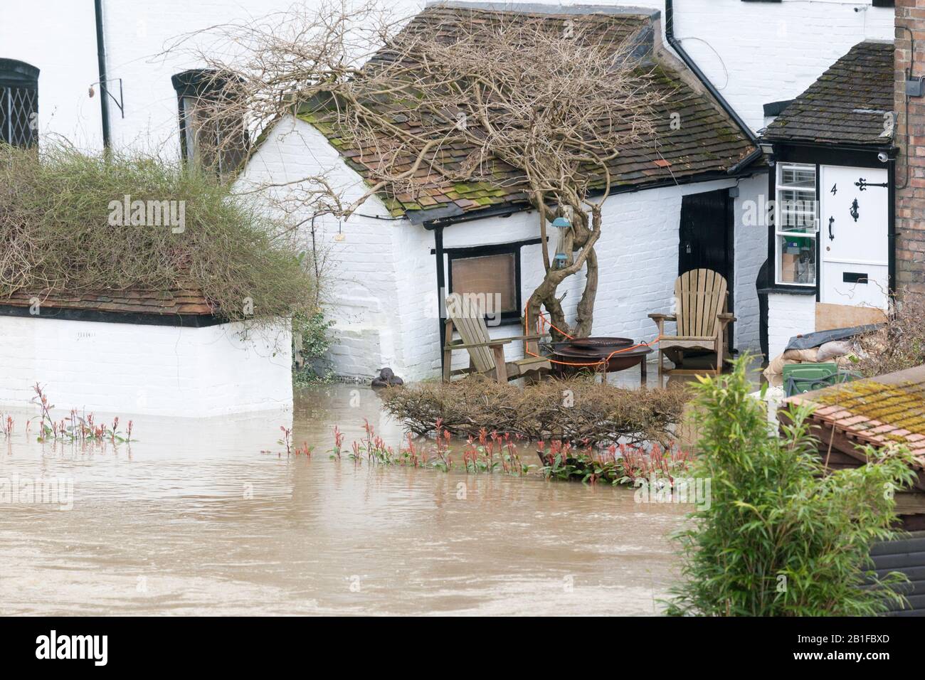Ironbridge, Shropshire, UK. 25th Feb, 2020. Severe flood warning in place on the River Severn at Ironbridge, Shropshire. A house on the riverside is flooded. Credit: Peter Lopeman/Alamy Live News Stock Photo