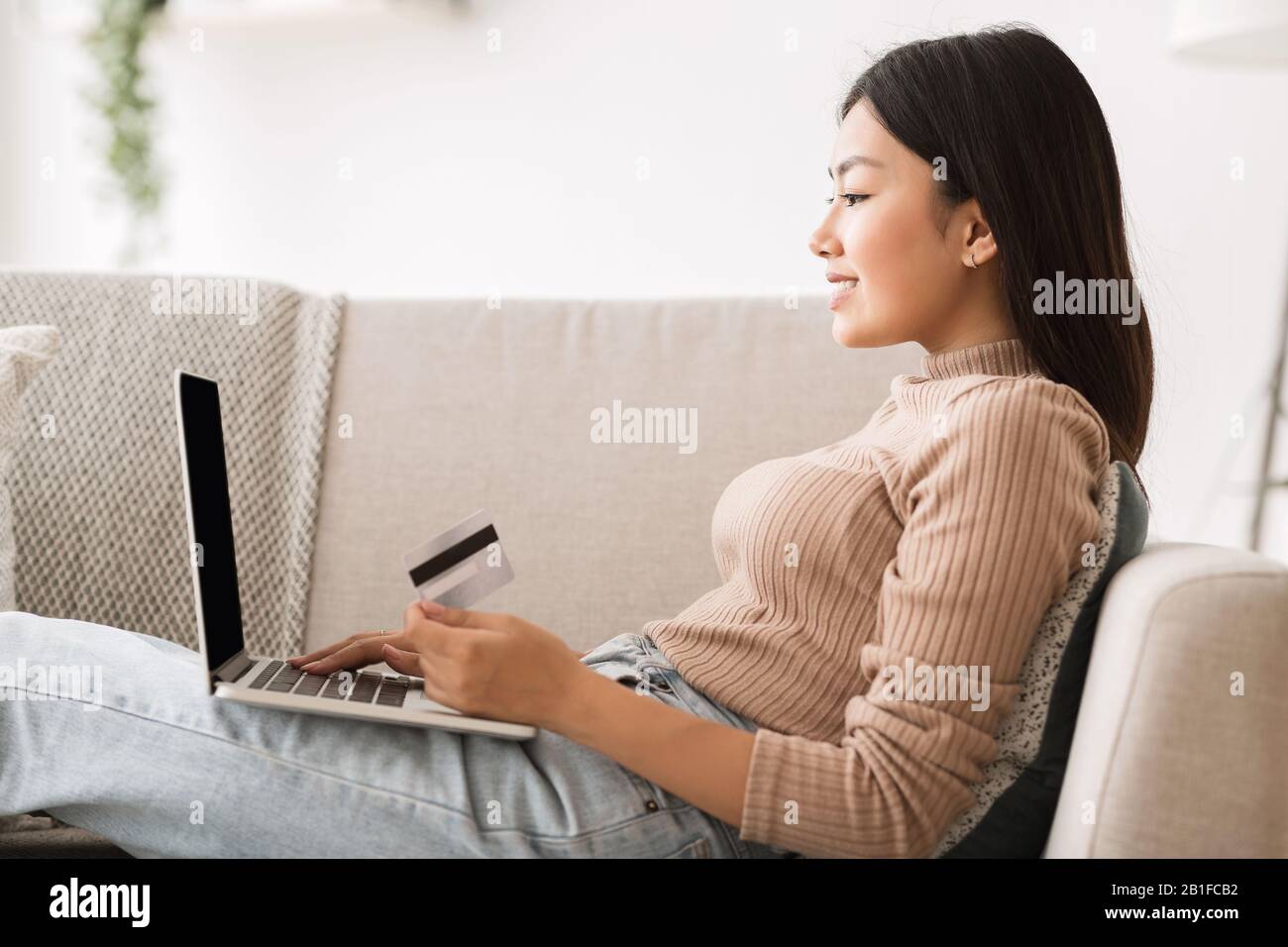 Online banking. Girl making purchases in internet Stock Photo