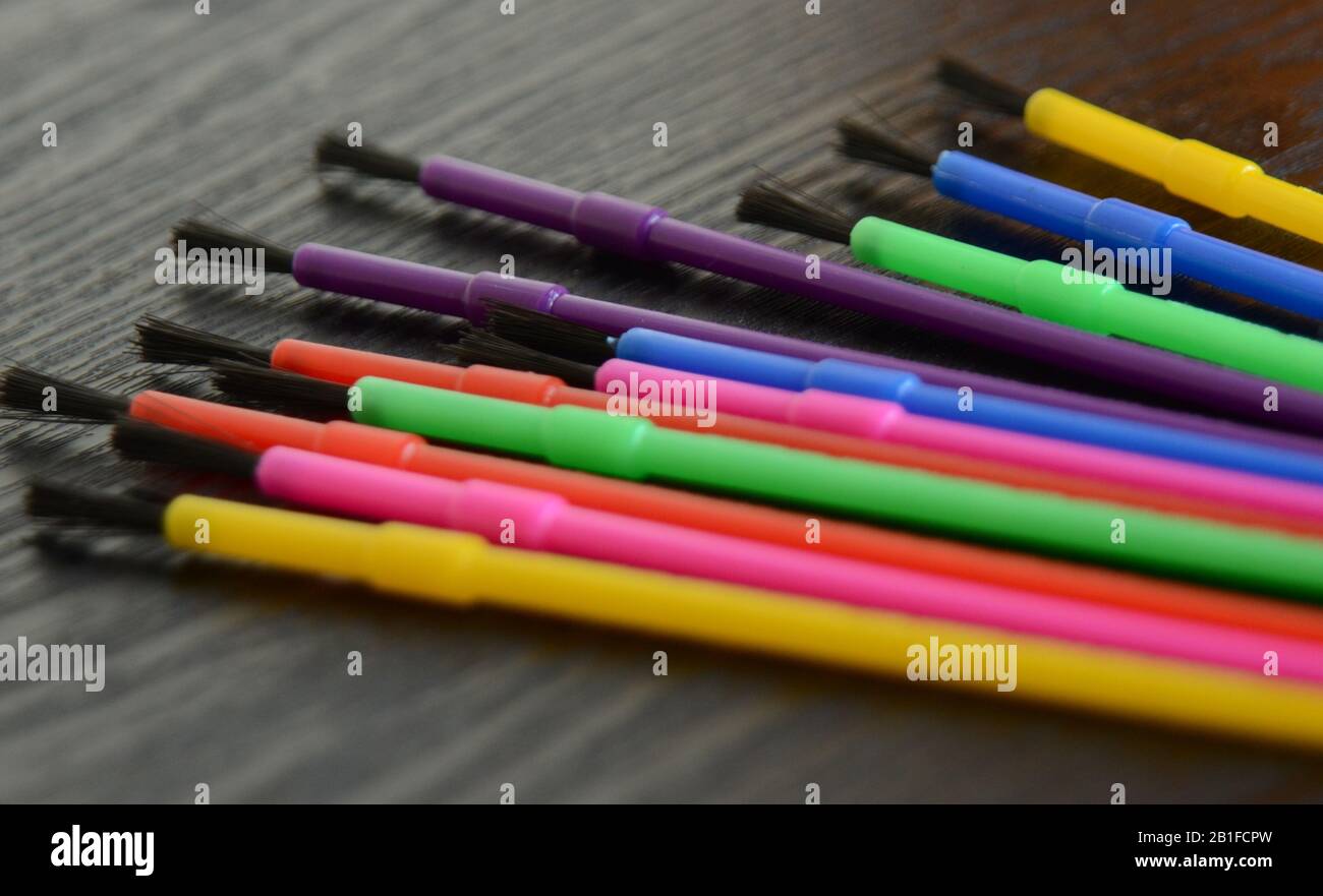COLORING BOOK: A rainbow colored assortment of paint brushes Stock Photo