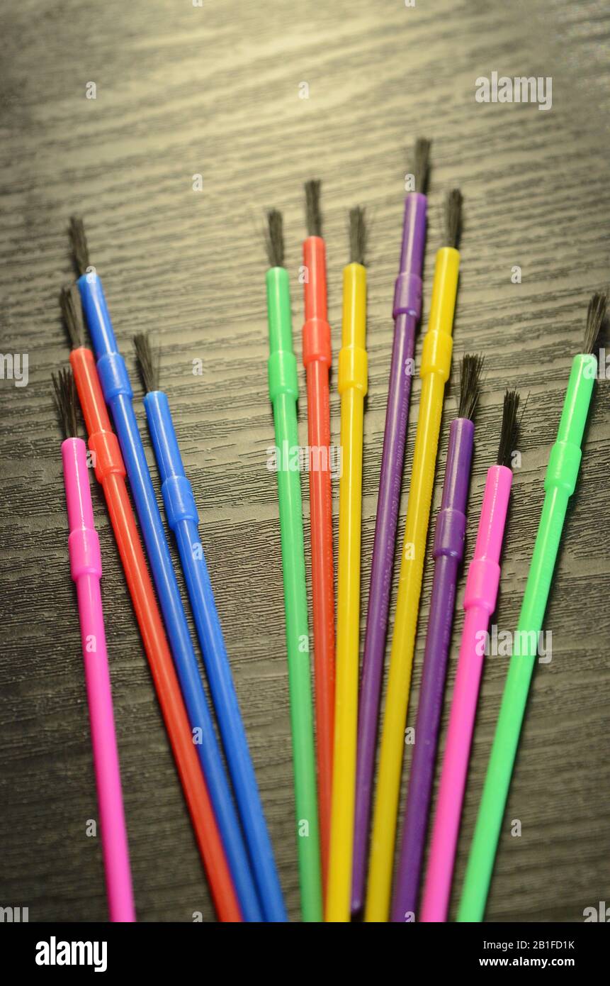 COLORING BOOK: A rainbow colored assortment of paint brushes Stock Photo