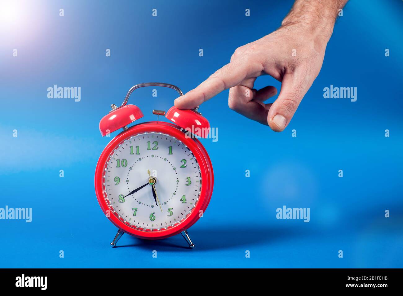 Man woman alarm clock bed hires stock photography and images Alamy