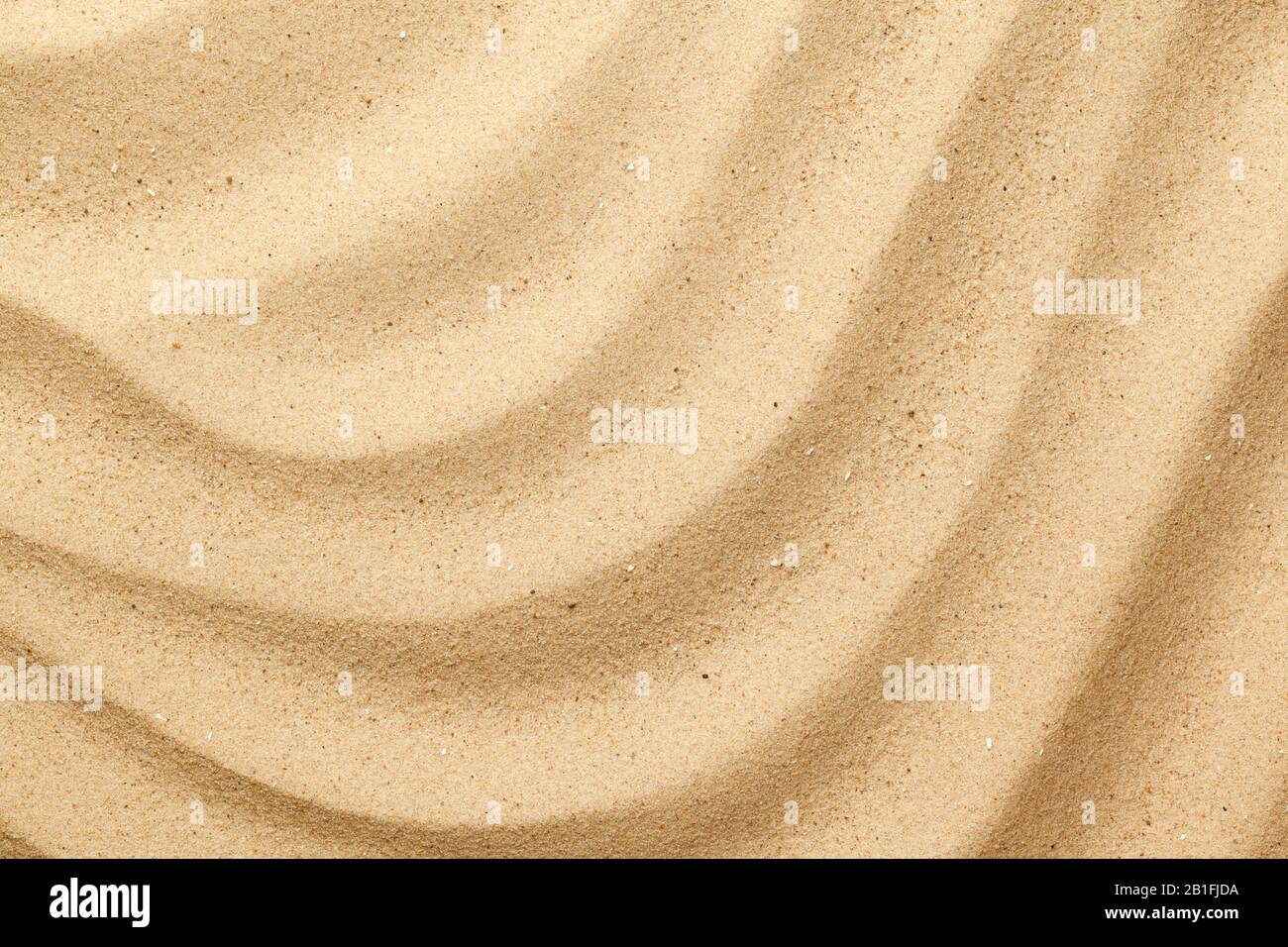 Wavy sea sand background. Flat lay. Top view Stock Photo