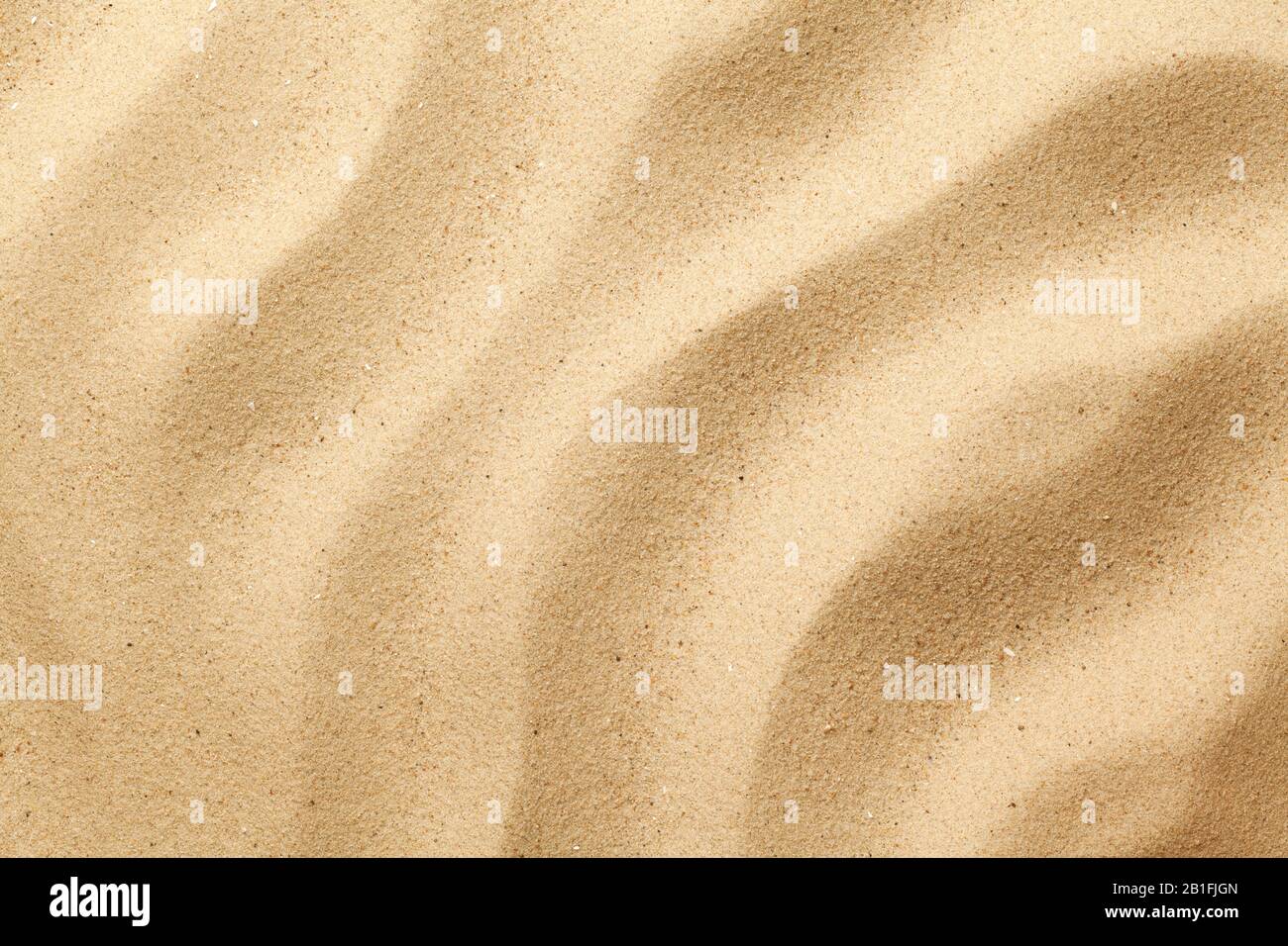 Wavy sand background for summer designs. Flat lay, top view Stock Photo