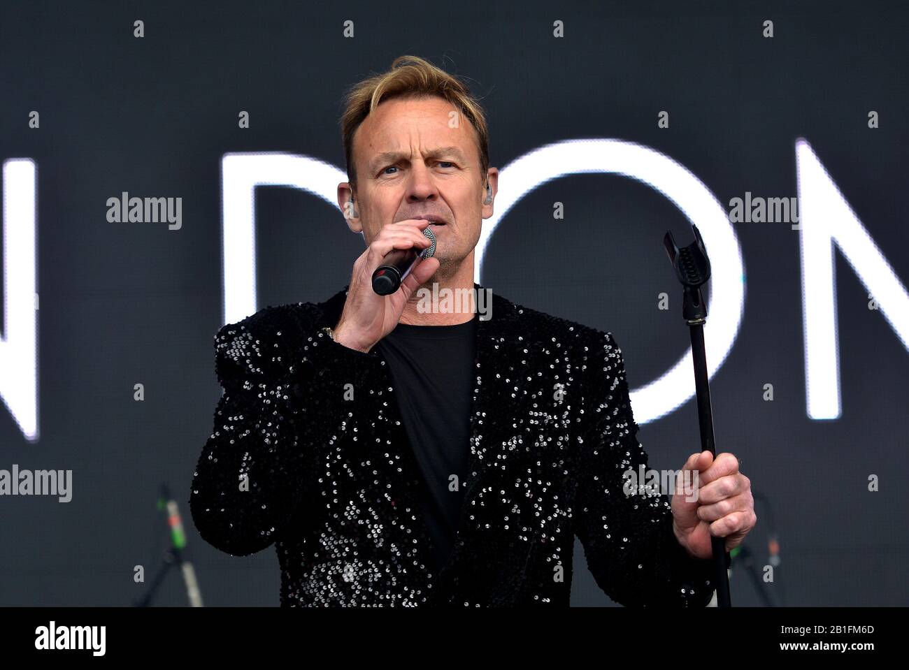 Jason Donovan preforming live on stage at music festival 2019 Stock Photo
