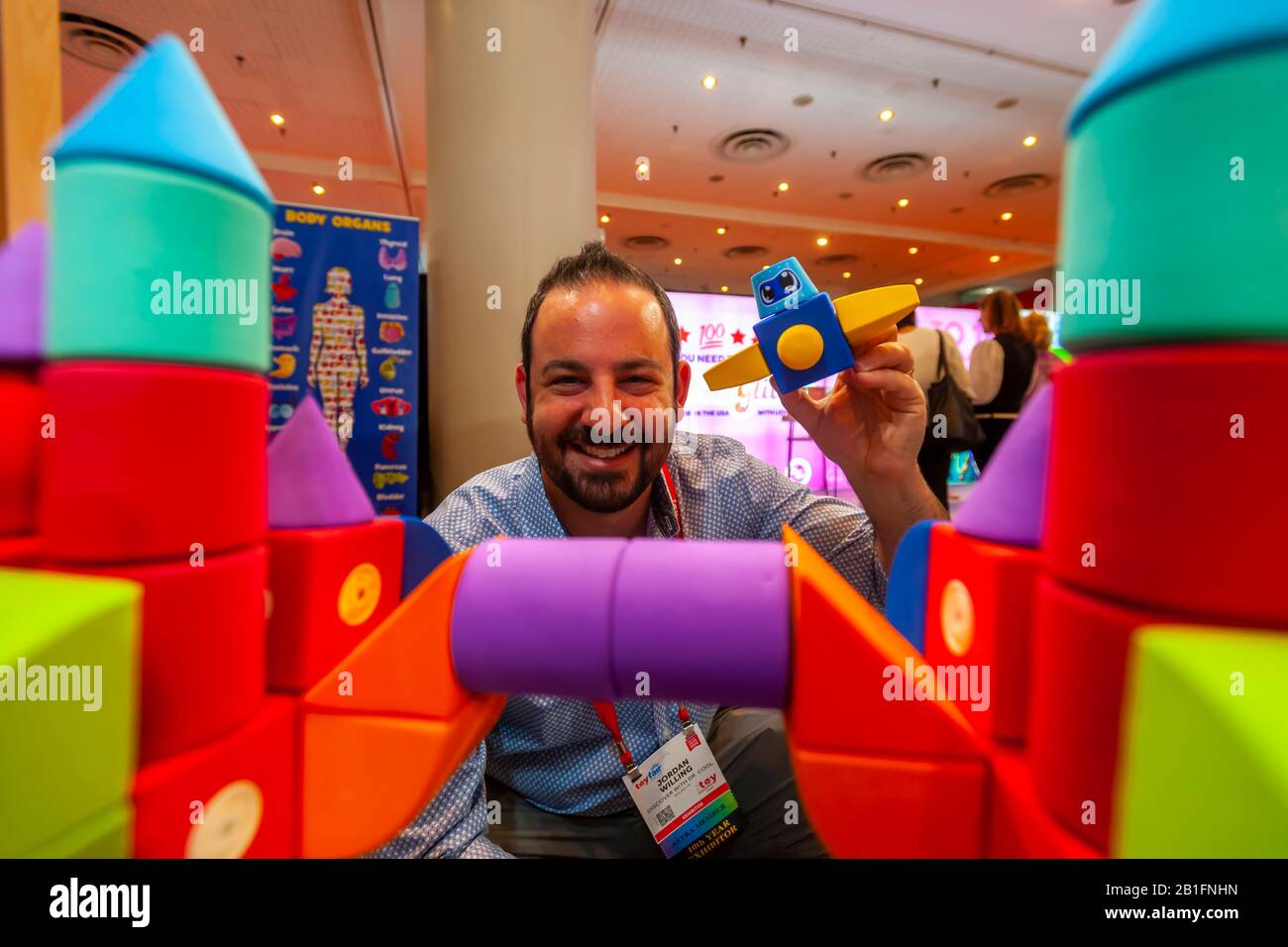 Jordan Willing, inventor of Blockaroos at the 117th North American International Toy Fair in the Jacob Javits Convention center in New York on Sunday, February 23, 2020.  The four day trade show with over 1000 exhibitors connects buyers and sellers and draws tens of thousands of attendees.  The toy industry generates over $26 billion in the U.S. alone and Toy Fair is the largest toy trade show in the Western Hemisphere. (© Richard B. Levine) Stock Photo