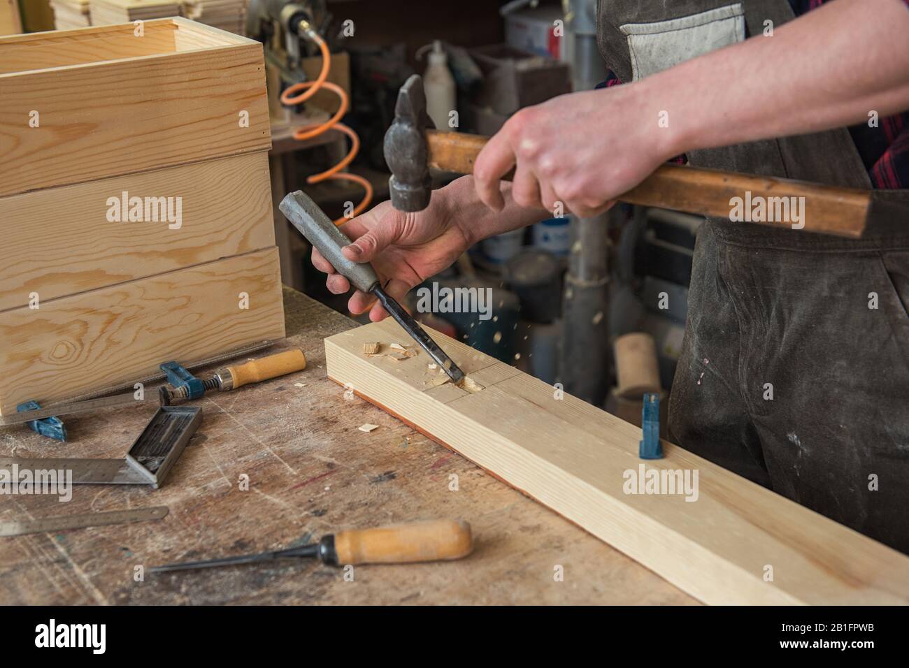 Carpenter working with a chisel Stock Photo - Alamy