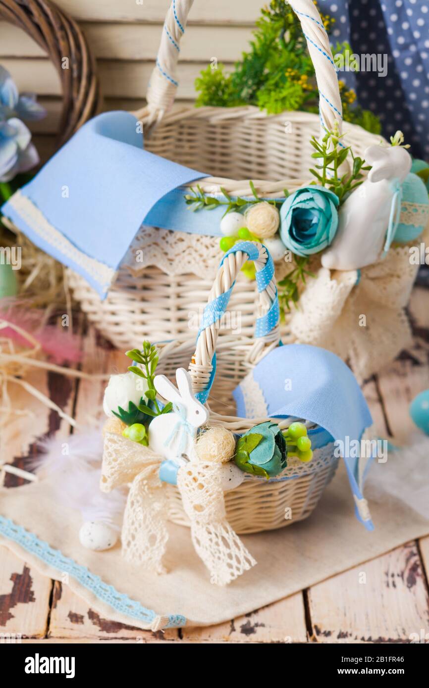 Easter baskets with flowers, composition in blue colours Stock Photo