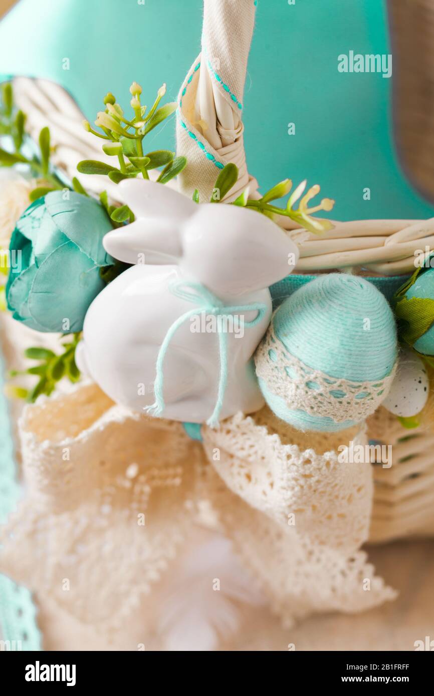Cute ceramic Easter bunny and dyed eggs Stock Photo