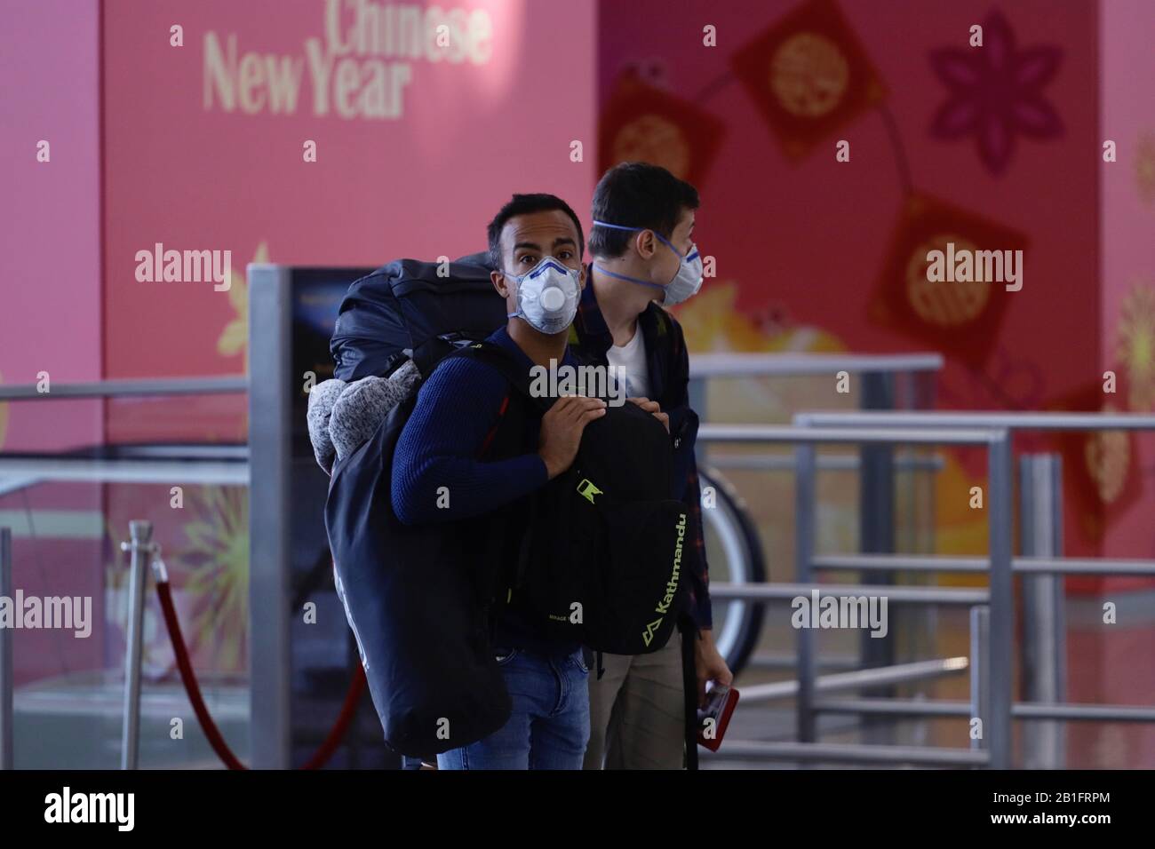 Hong Kong, CHINA. 24th Feb, 2020. Departing foreign visitors put on ...