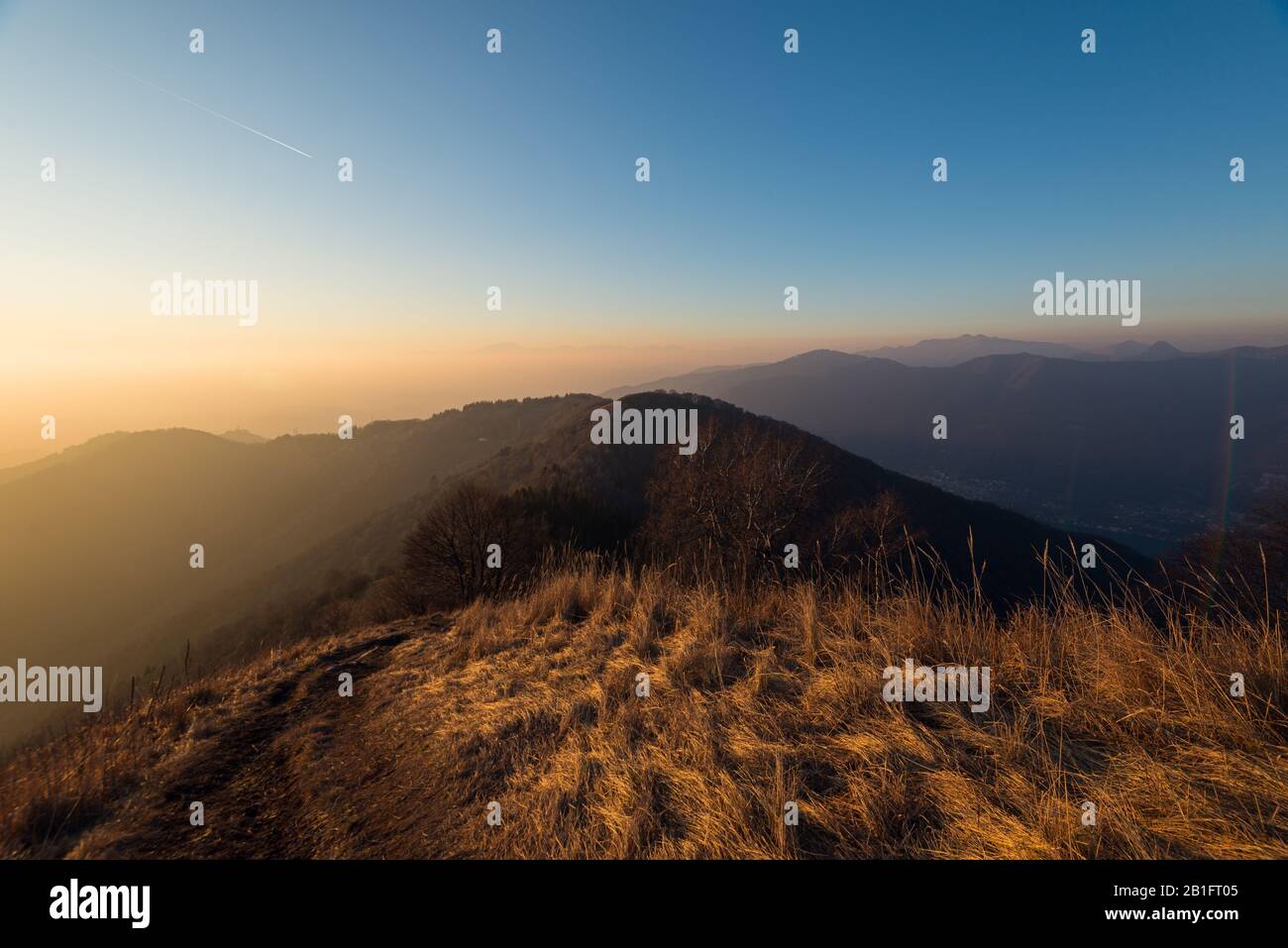 sunset landscape from Monte Boletto during a sunny winter day, Brunate, Como, Italy Stock Photo