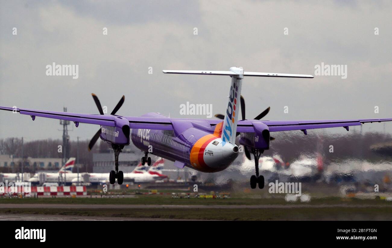 De Havilland Canada Dash 8-400 (G-PRPH) owned and operated by Flybe lands at Heathrow Airport. PA Photo. Picture date: Tuesday February 25, 2020. See PA story . Photo credit should read: Steve Parsons/PA Wire Stock Photo