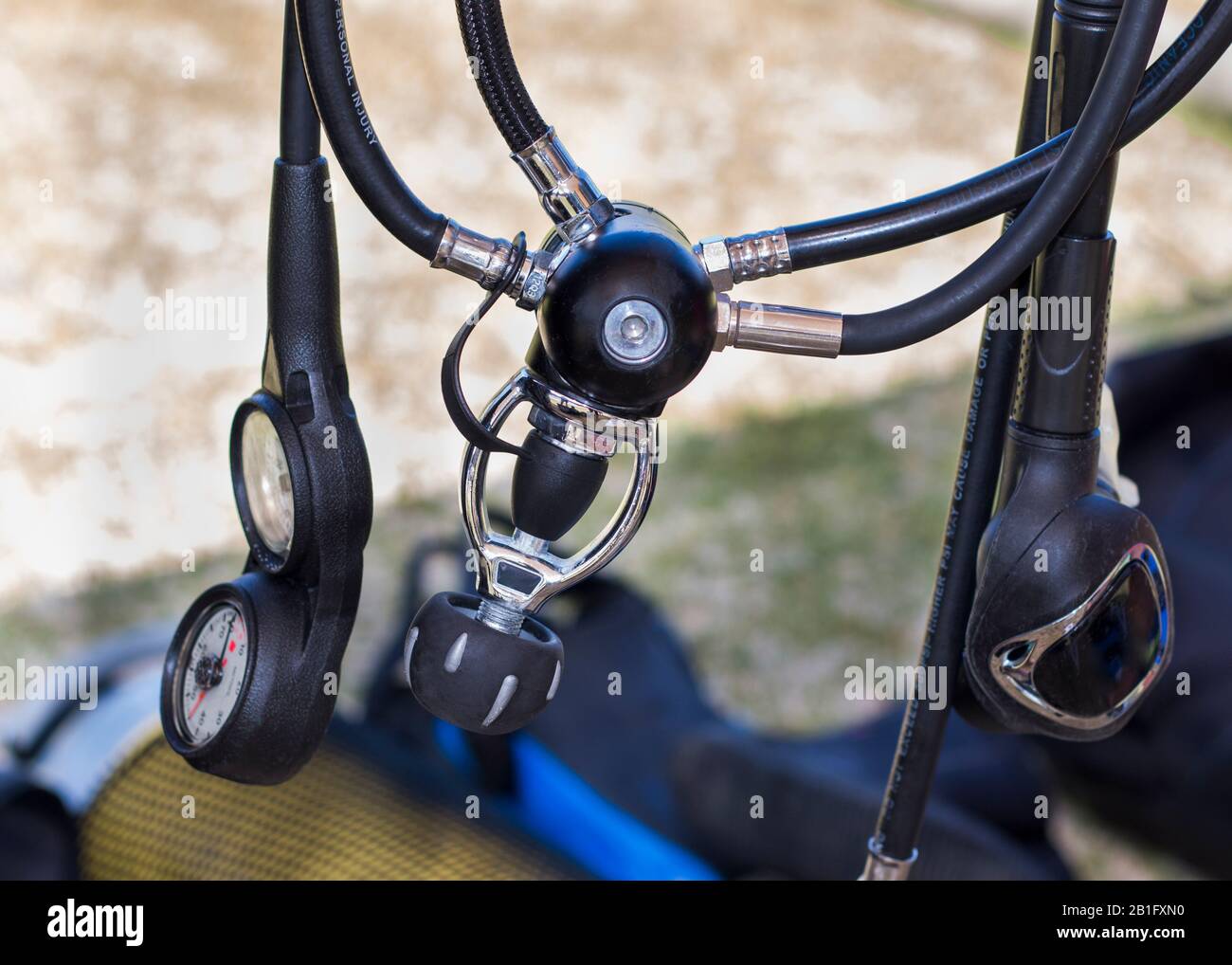 Scuba diving equipment regulator rolled up and hanging down with