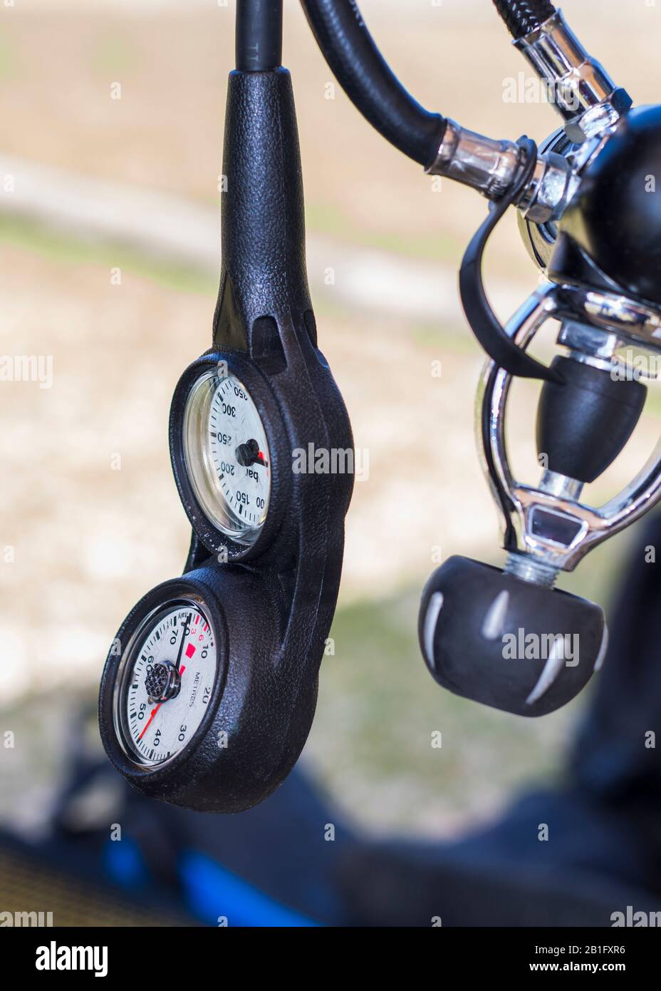 Scuba diving equipment regulator rolled up and hanging down with