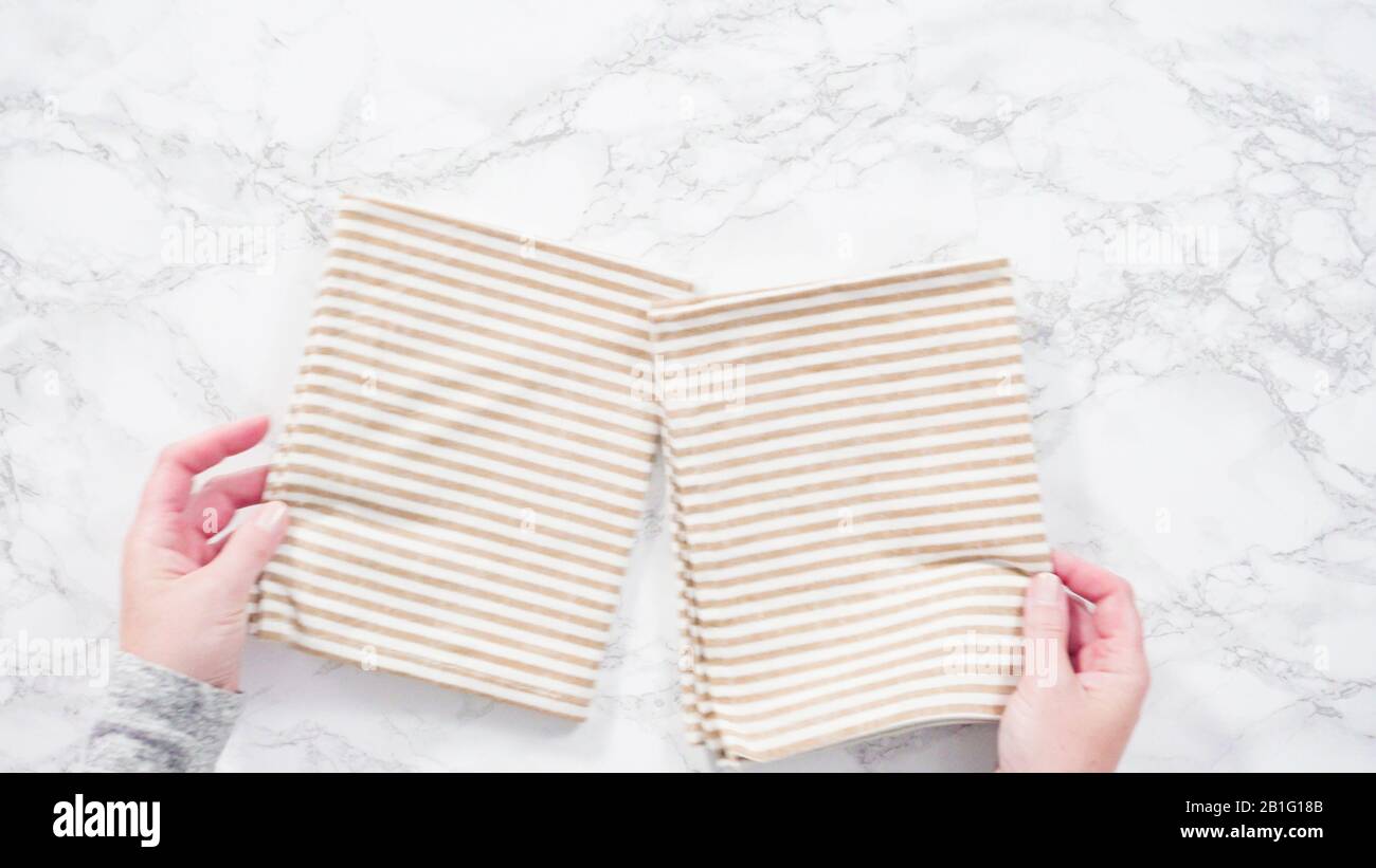 Flat lay. Folding kitchen towels on a marble countertop Stock Photo Alamy