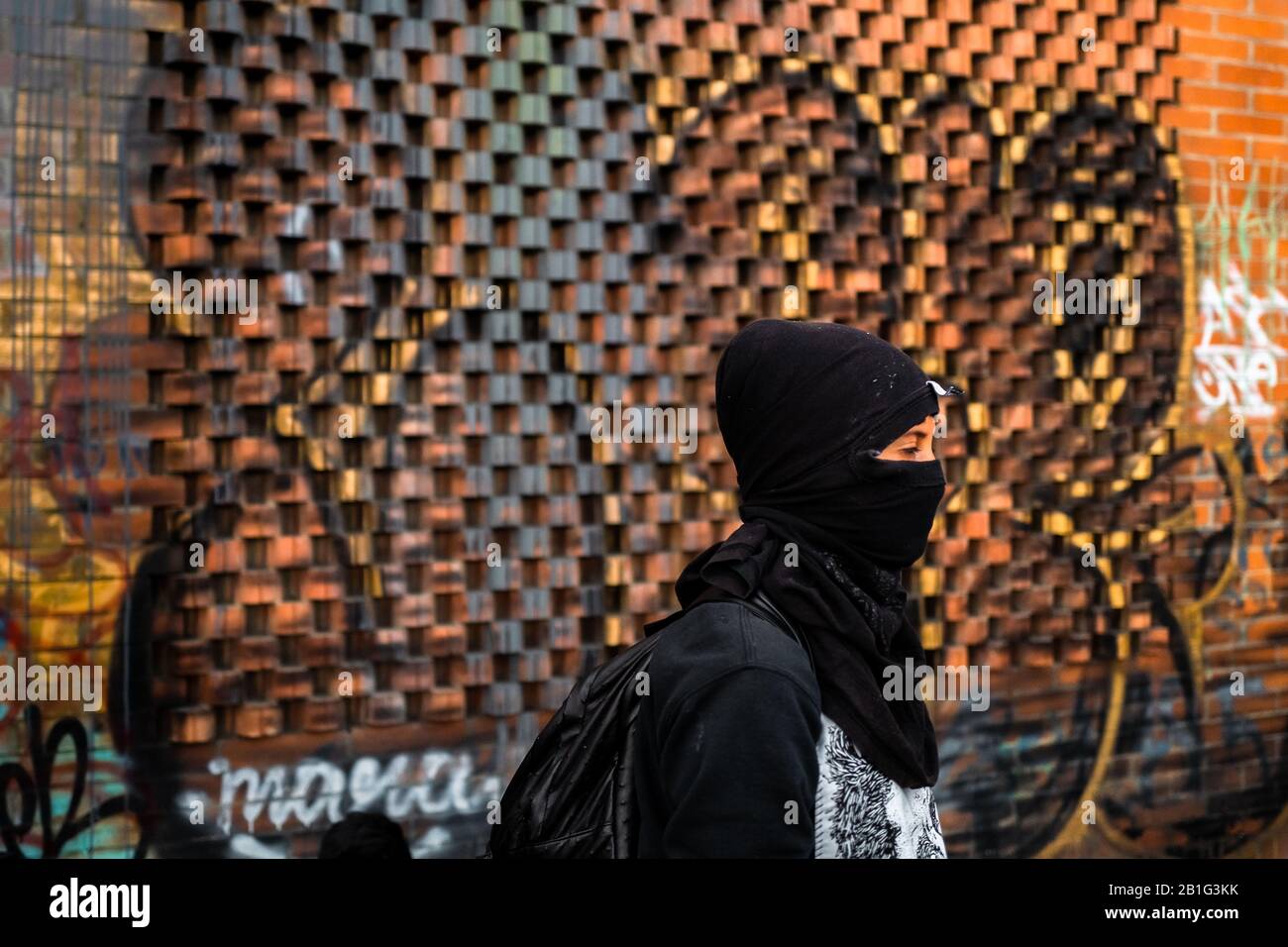 A radical student takes part in a protest march against government’s policies in Bogotá, Colombia. Stock Photo