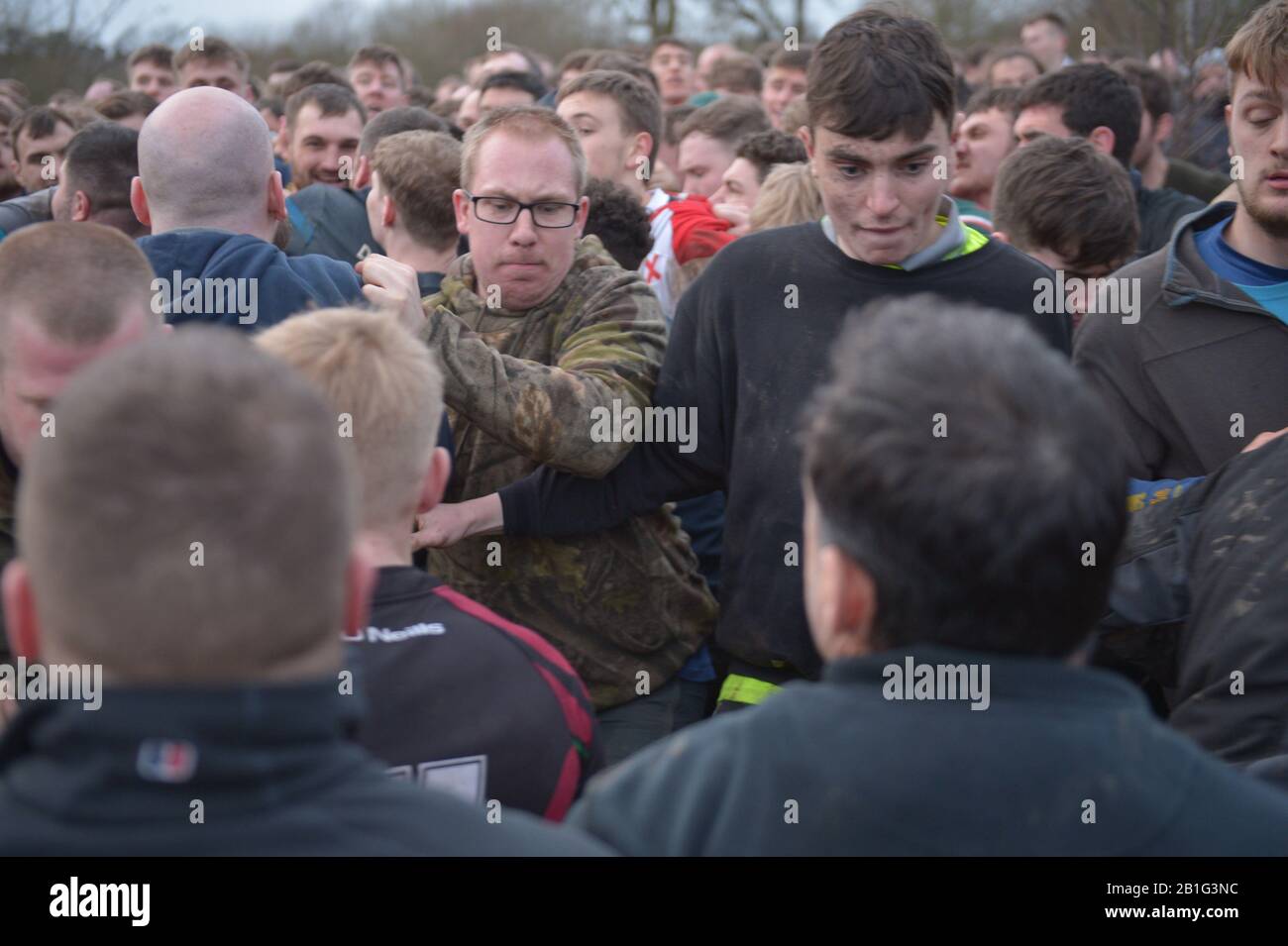 Players take part in the Royal Shrovetide Football Match in Ashbourne, Derbyshire, which has been played in the town since the 12th century. Stock Photo