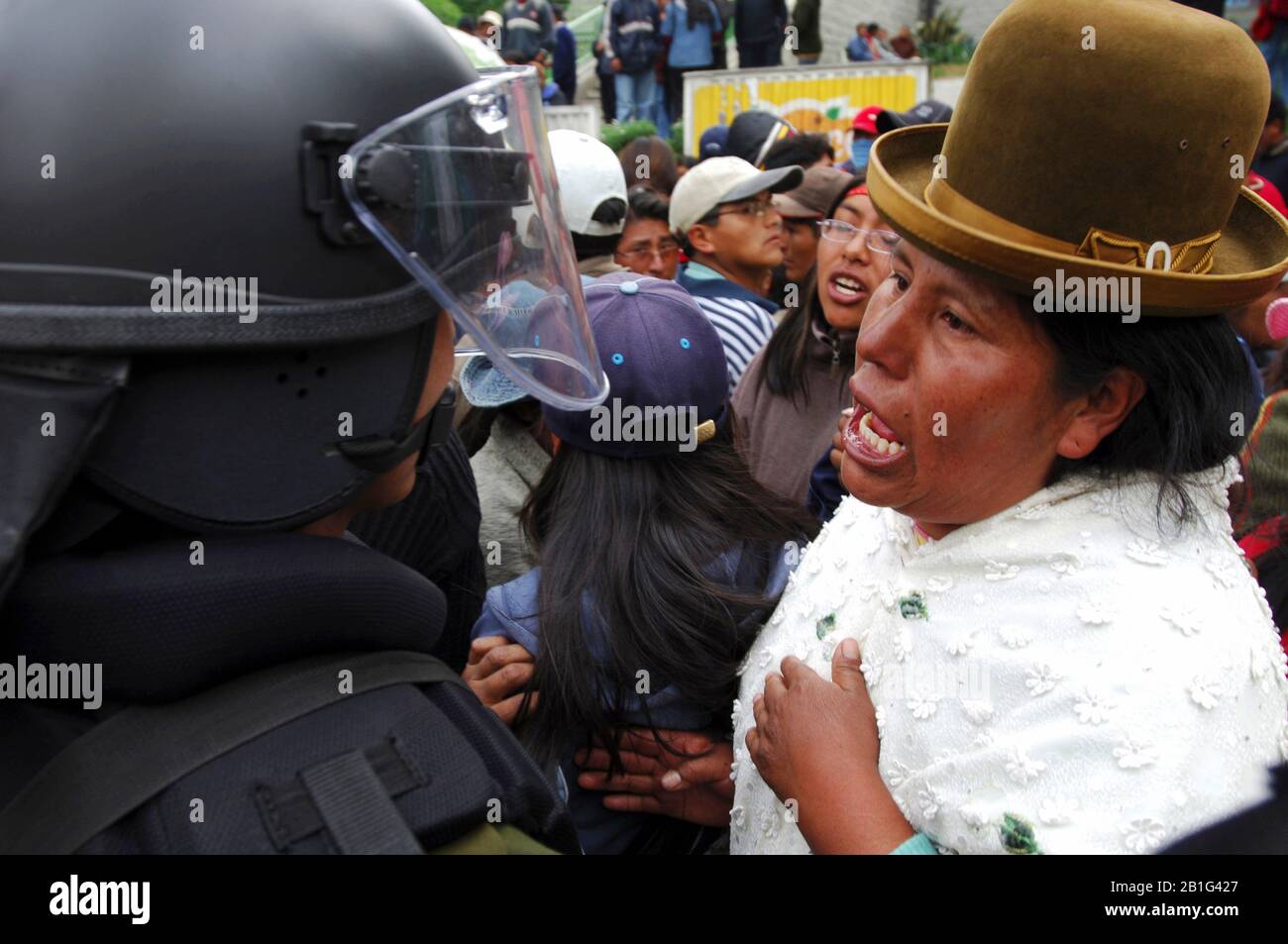 A woman confronts a riot police officer at one of the student demonstrations Stock Photo
