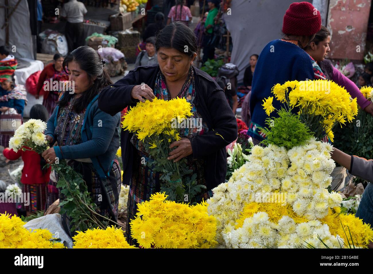 Women selling flowers in Chichicastenango market Stock Photo