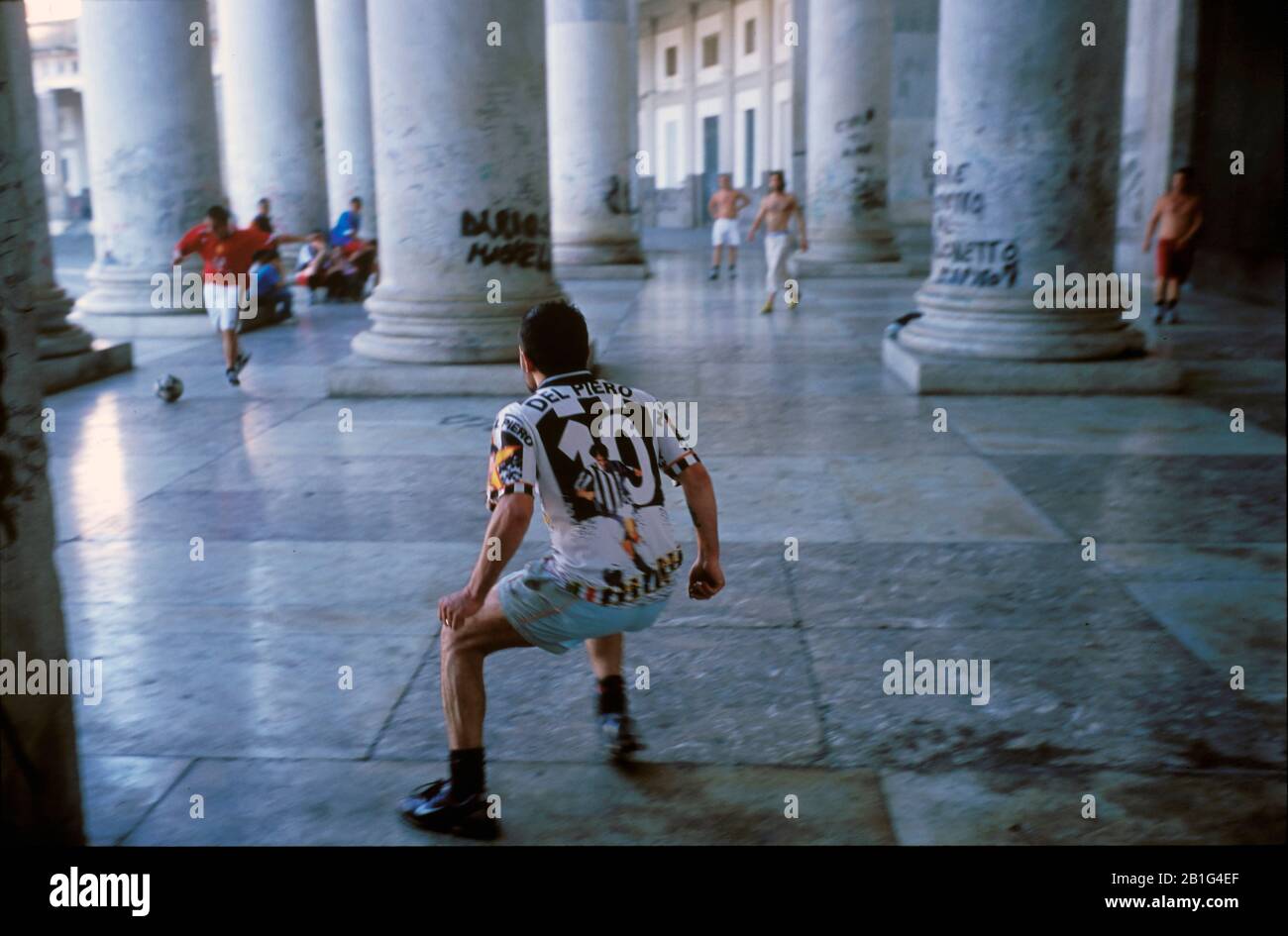 A group of friends play soccer in the square of the Plebiscite Stock Photo
