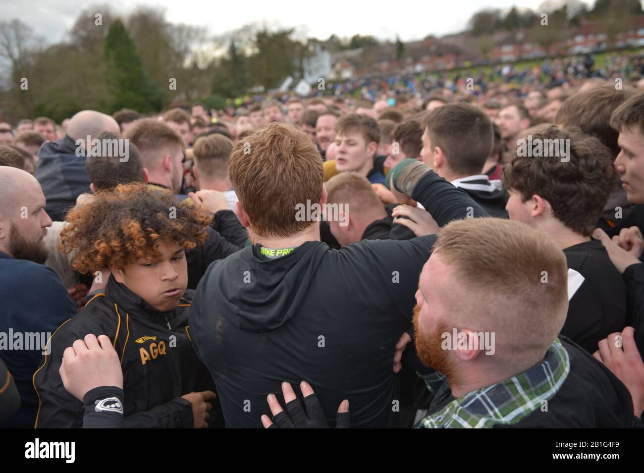 Players take part in the Royal Shrovetide Football Match in Ashbourne, Derbyshire, which has been played in the town since the 12th century. Stock Photo