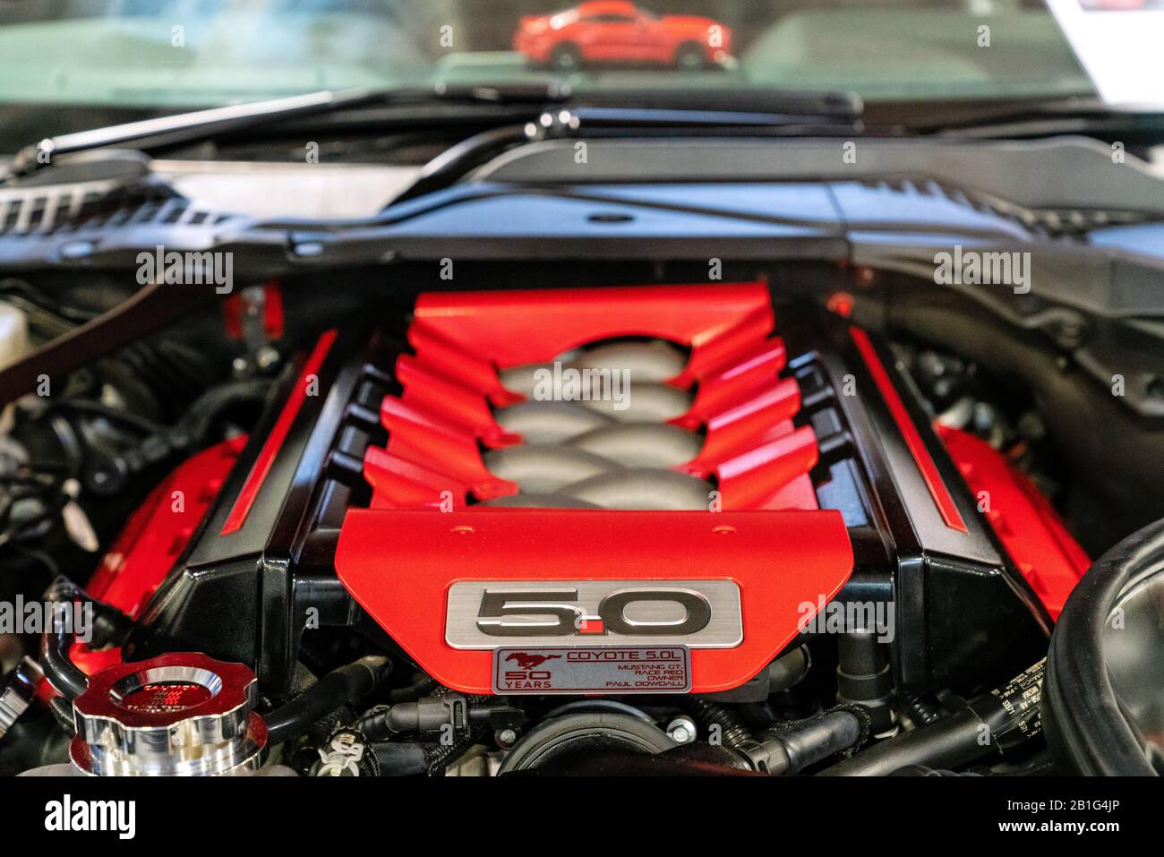 22 Feb 2020 - London, UK. Close up detail of the modular V8 engine with a 5.0L displacement named Coyote. Stock Photo