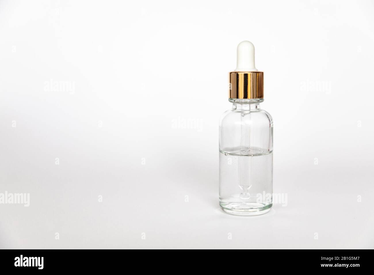Dropper glass Bottle Mock-Up wth hyaluronic acid on white background, beauty serum Stock Photo