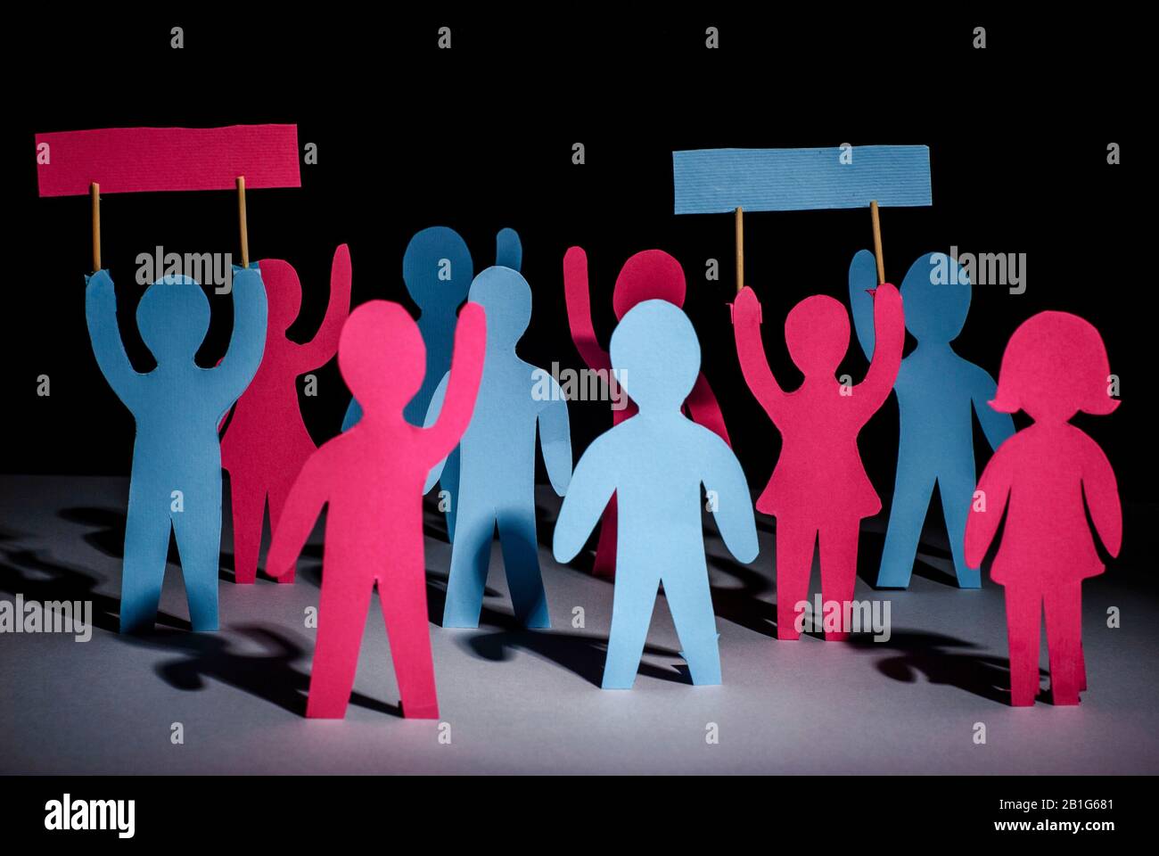 paper men with hands up holding tables with protests. The concept of freedom and independence, democracy. Protesting people, bitterness. The meeting. Stock Photo