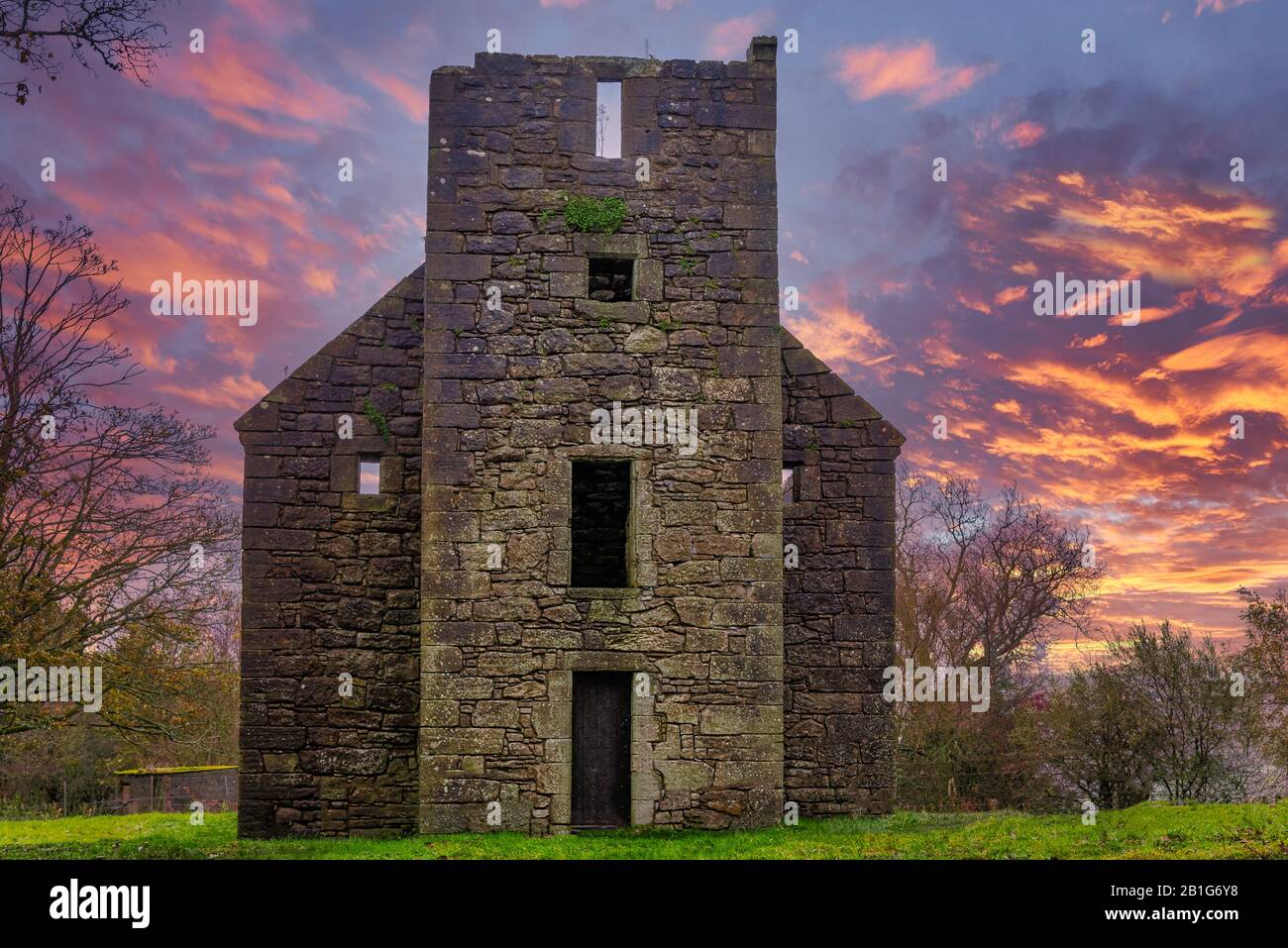 The Old Semple Ruins at Castle Semple in Renfrewshire Scotland at a Blazing Red sunset Stock Photo