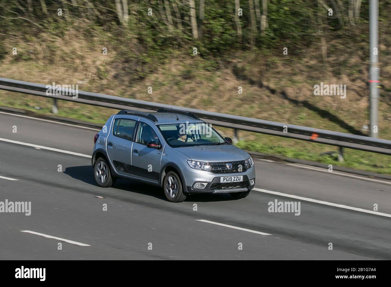 2019 grey Dacia Sandero Stepway Techroad; driving on the M6 motorway near Preston in Lancashire, UK Stock Photo