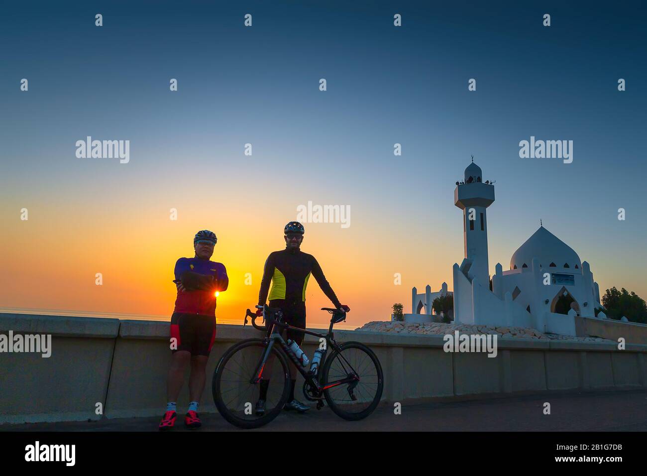 Two Cyclist standing in front of Beautiful Al Khobar Corniche Mosque Saudi Arabia 31-Jan-2020. Stock Photo