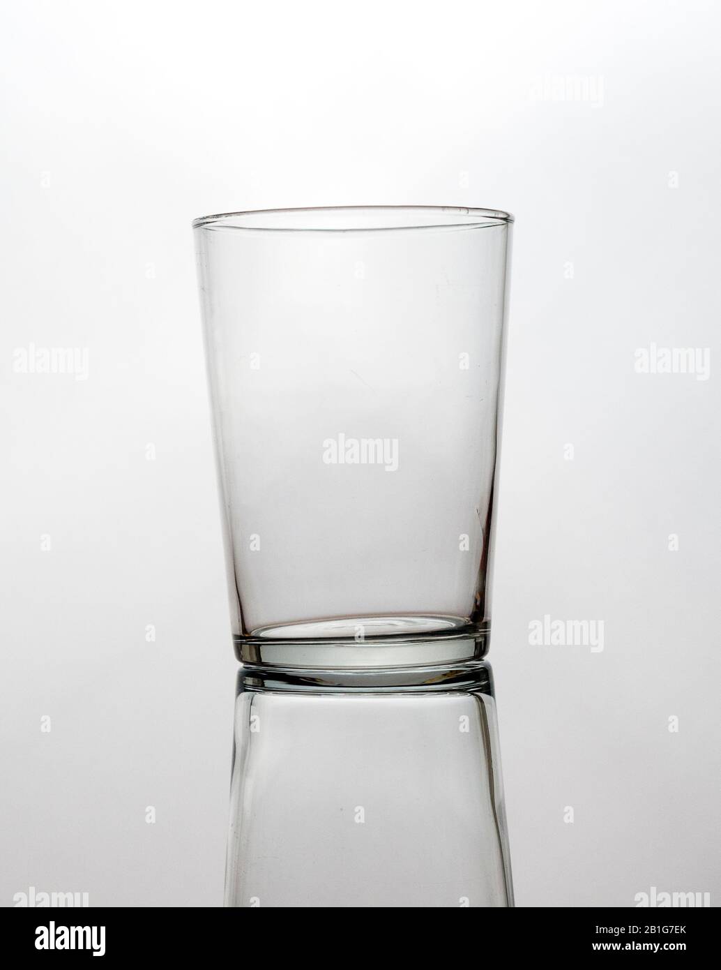 Empty glass with reflection isolated on a white background Stock Photo