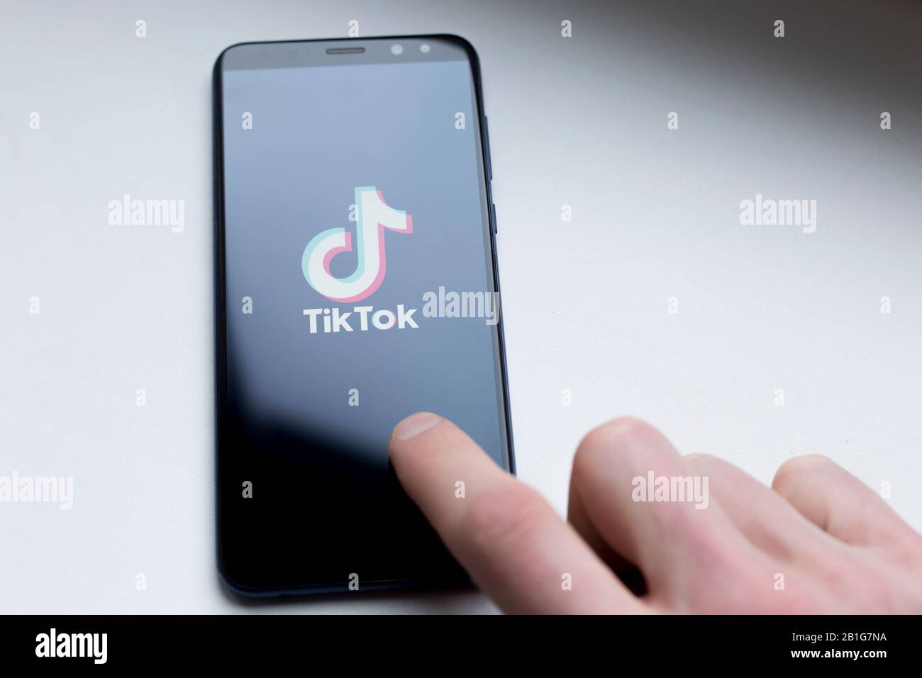 Ukraine, Kyiv - Dec. 22th, 2019 : Tik Tok logo on the phone screen. Application for creating short videos. Stock Photo