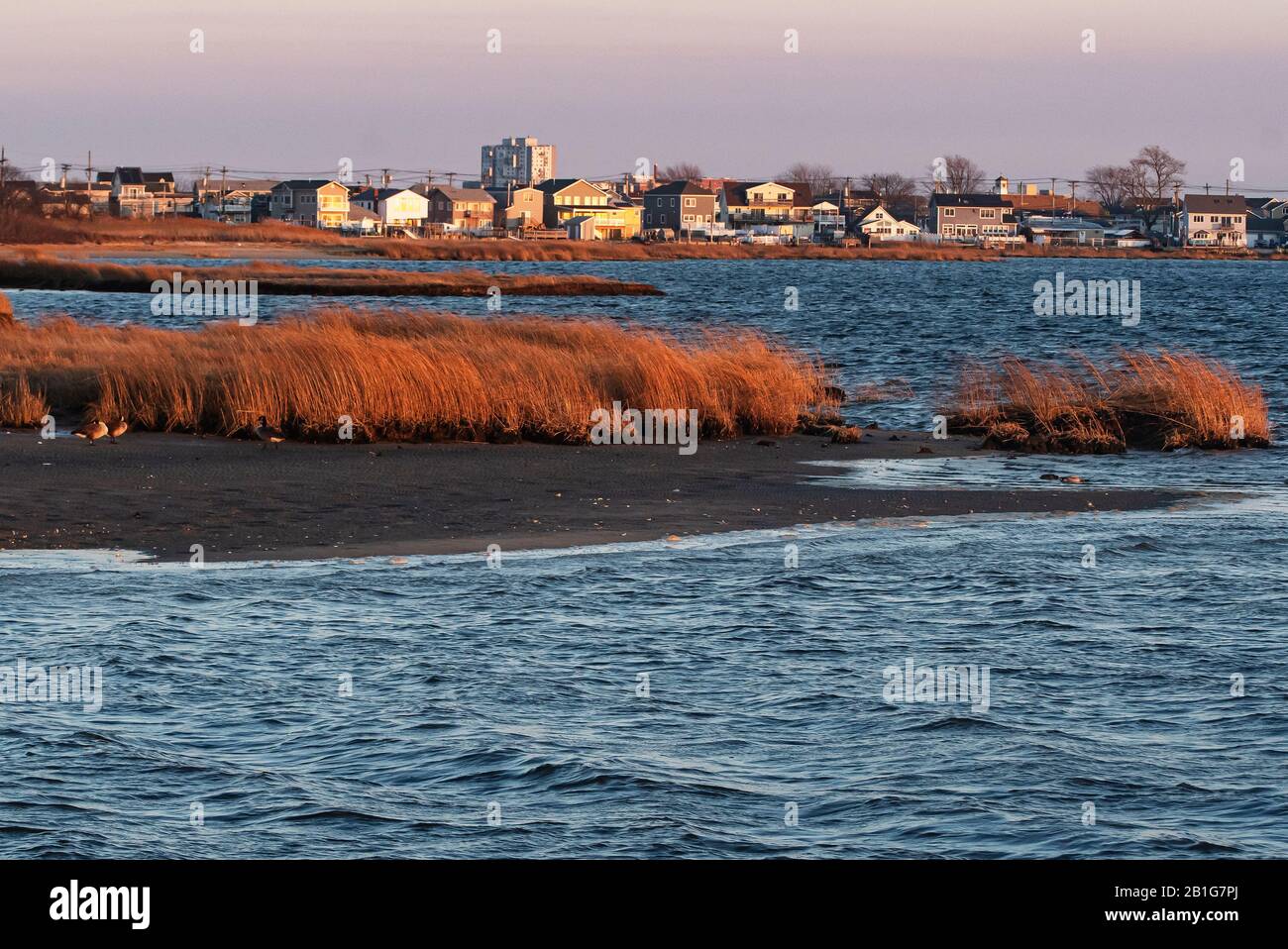 Jamaica Bay salt marsh and community of Broad Channel in late afternoon golden light Stock Photo